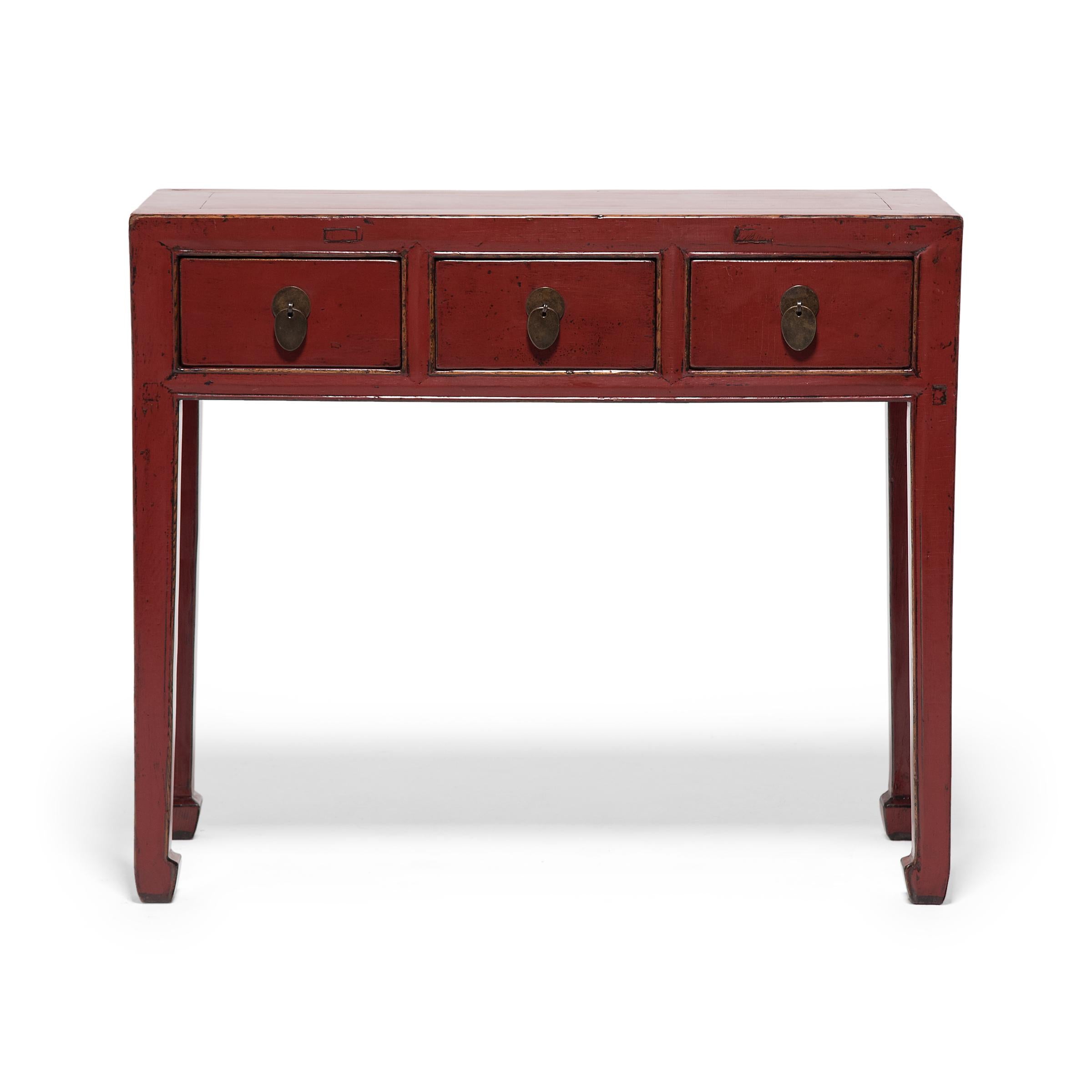 Dated to the early 20th century, this shallow console table was originally used for general storage or as an altar for burning incense during ancestor worship. The table has a simple design suitable for any interior, featuring a squared frame,