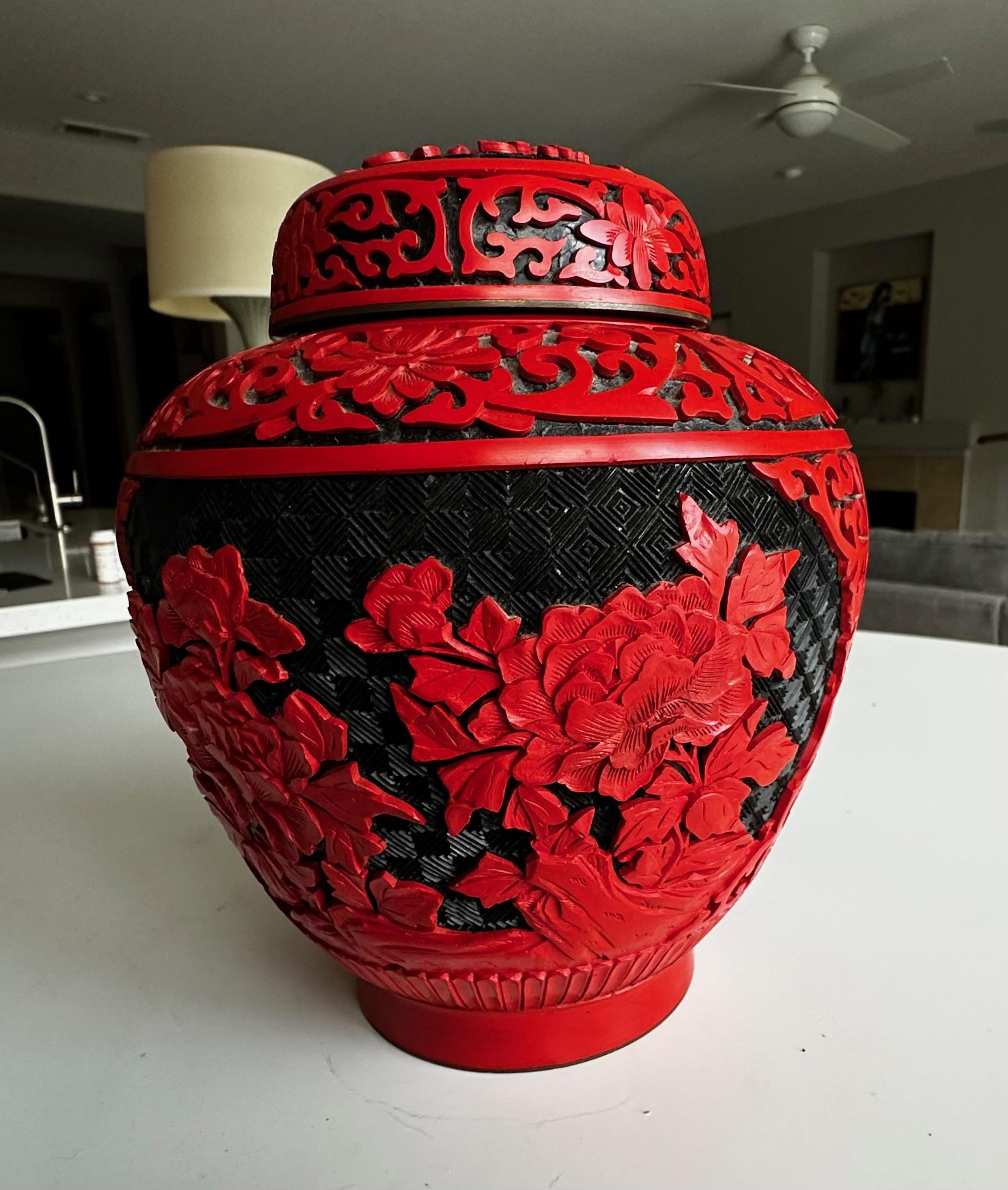 Well crafted Chinese cinnabar lacquered lidded vase with brass lining.