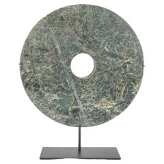 Used Chinese circular cut jade bi on stand
