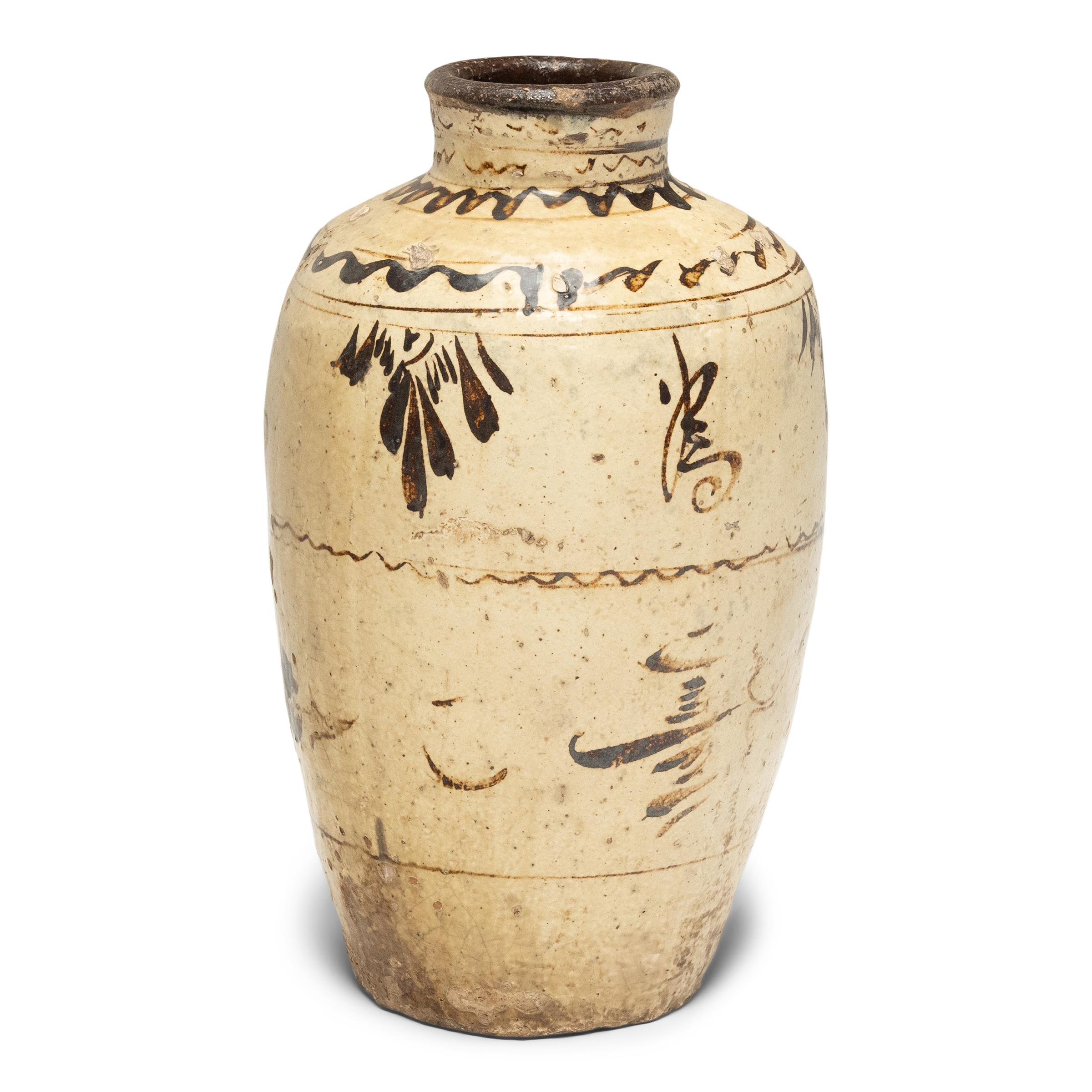 This glazed vessel dates to the mid-19th century and was used to store wine and spirits made from rice and other grains. The jar has an elegant, tapered form and is beautifully glazed with neutral earth-tones in a style characteristic of cizhou
