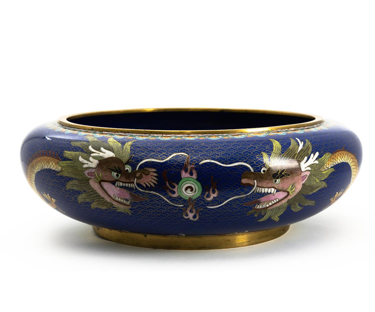 Offered is the stunningly beautiful dragon cloisonné bowl in with a golden dragon set in a deep blue background. The five toed dragons a sure sign the age is 20th century but like early or mid-20th century as this bowl has some age yet is in