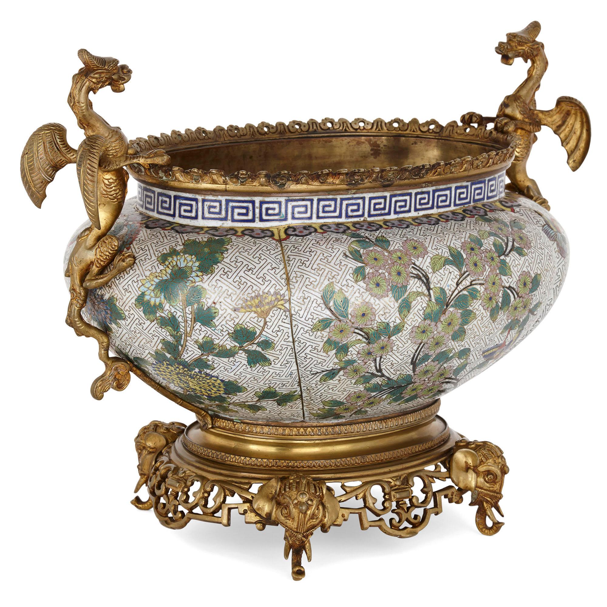 This exquisite cloisonné enamel jardinière was created in China in the 19th century, then exported to France, where it was mounted with gilt bronze elements. The piece speaks of the rich history of cultural exchange between the Far East and Europe.