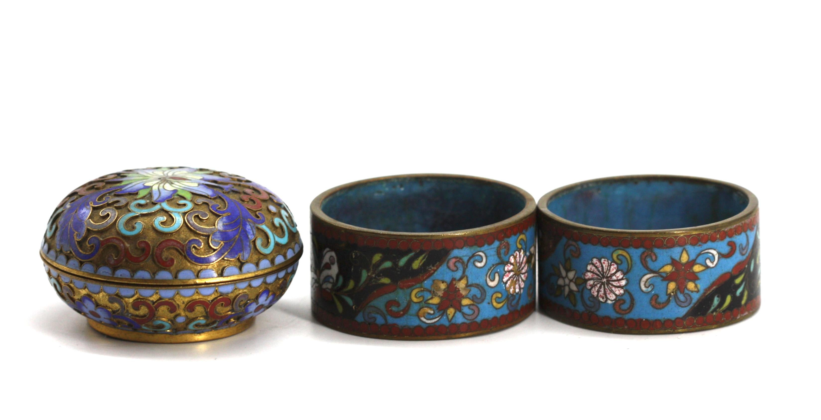 
Chinese Cloisonne Enamel Box
Together with Two Chinese Cloisonne Fabric Rings. (3 pieces)
Diameter of box 2.25 in.
Condition Report
Good condition.
