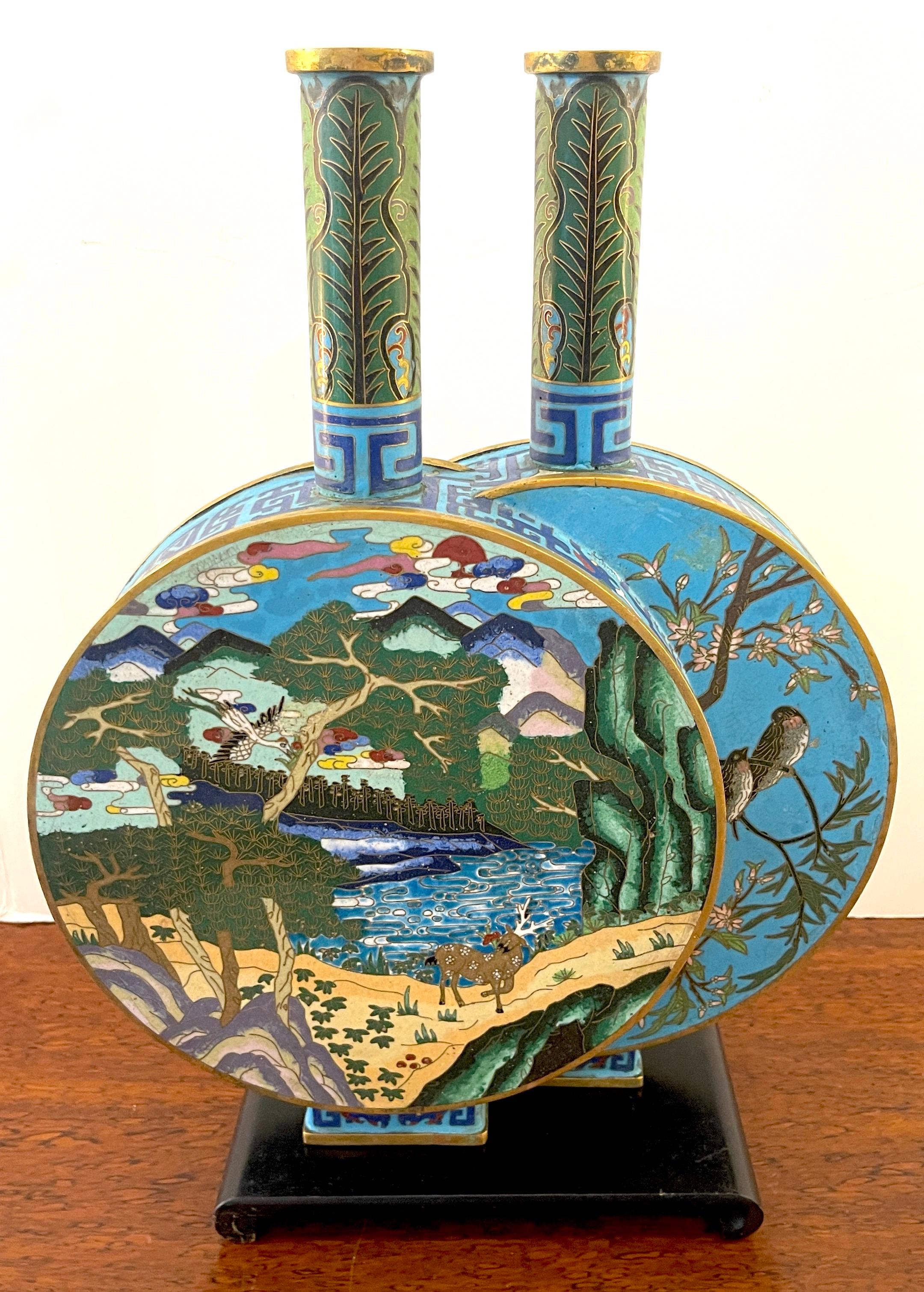 Chinese Cloisonné Enamel Double Moon Flask Vase, #048/100
China, 20th Century 
A masterwork of Chinese Cloisonné enamel technique. Shaped as two conjoined moonflasks, each with a circular body, a cylindrical neck and a rectangular spreading foot,
