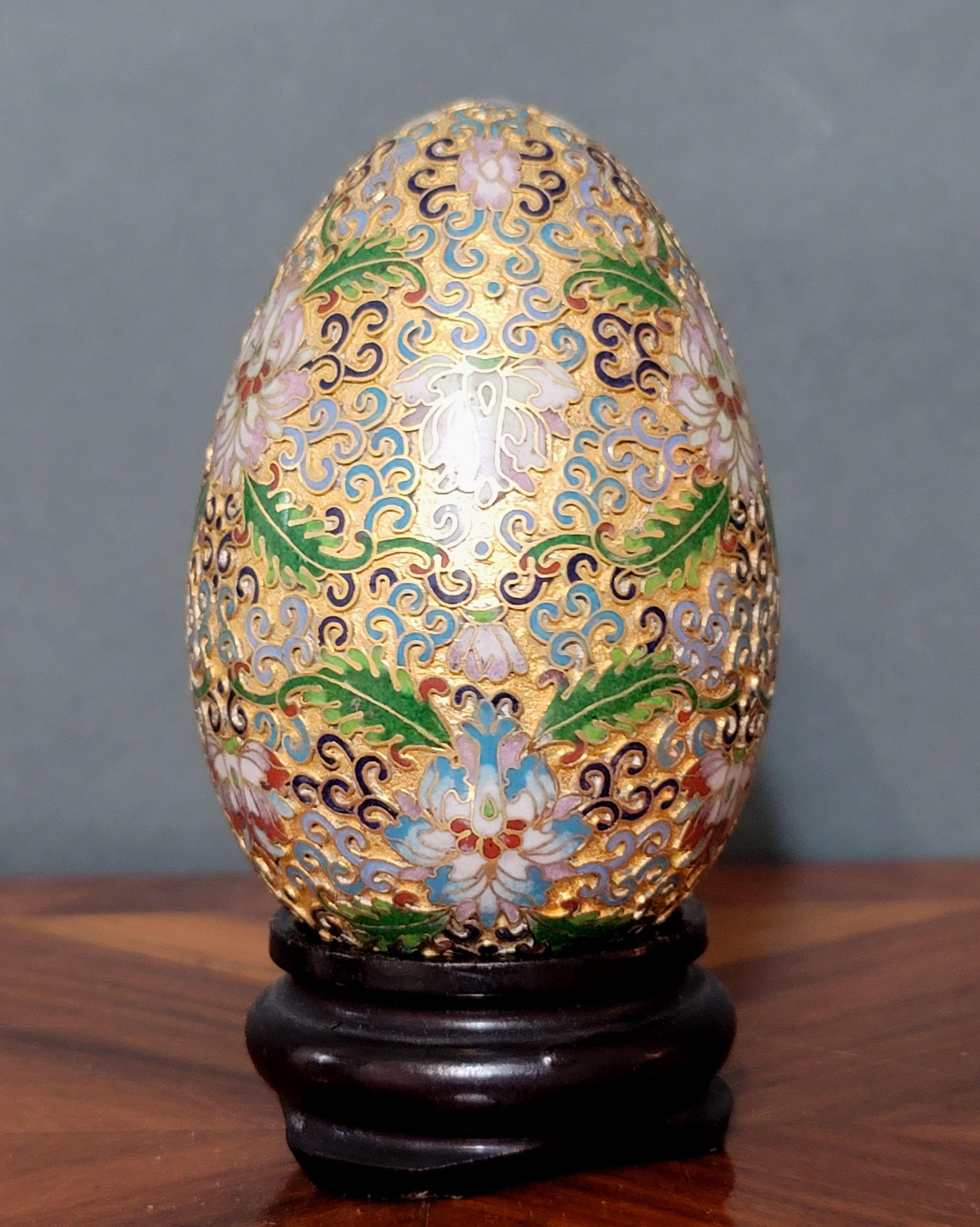 Presenting a cute Chinese cloisonné enamel egg with wood stand, early 20 century.