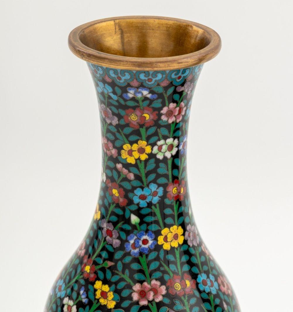 Pair of Chinese Cloisonne Floral Design Vases, polychrome flowers and vines on black grounds, each on carved wood base. Vase: 8