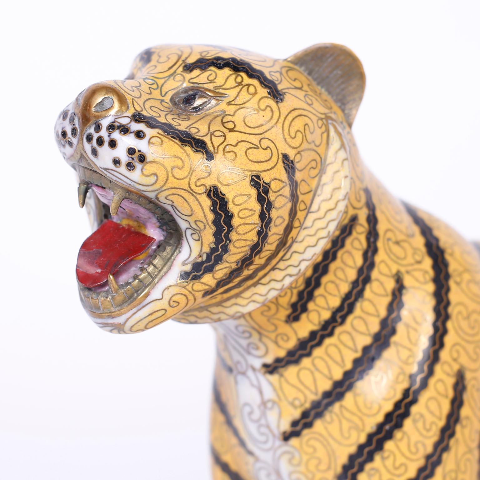 Rare antique Chinese tiger crafted with brass and enamel with striking elaborate detail in a familiar ferocious pose.