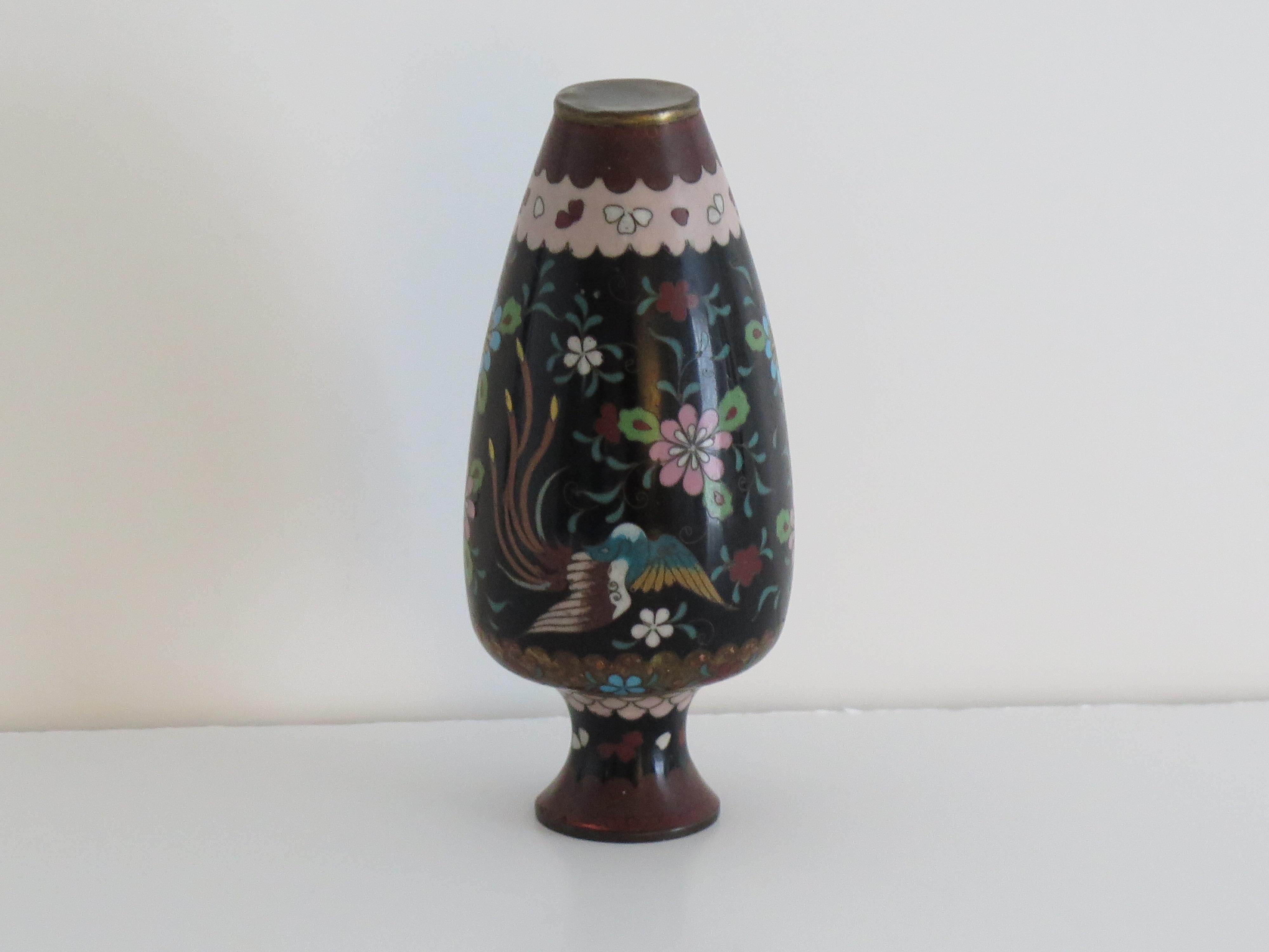 This is a very decorative Chinese cloisonné vase dating to the mid 19th Century, Qing period. 

The vase has a good baluster shape. It has been well made of a bronze alloy with rich enamels of many different colours, set into a black ground.

The