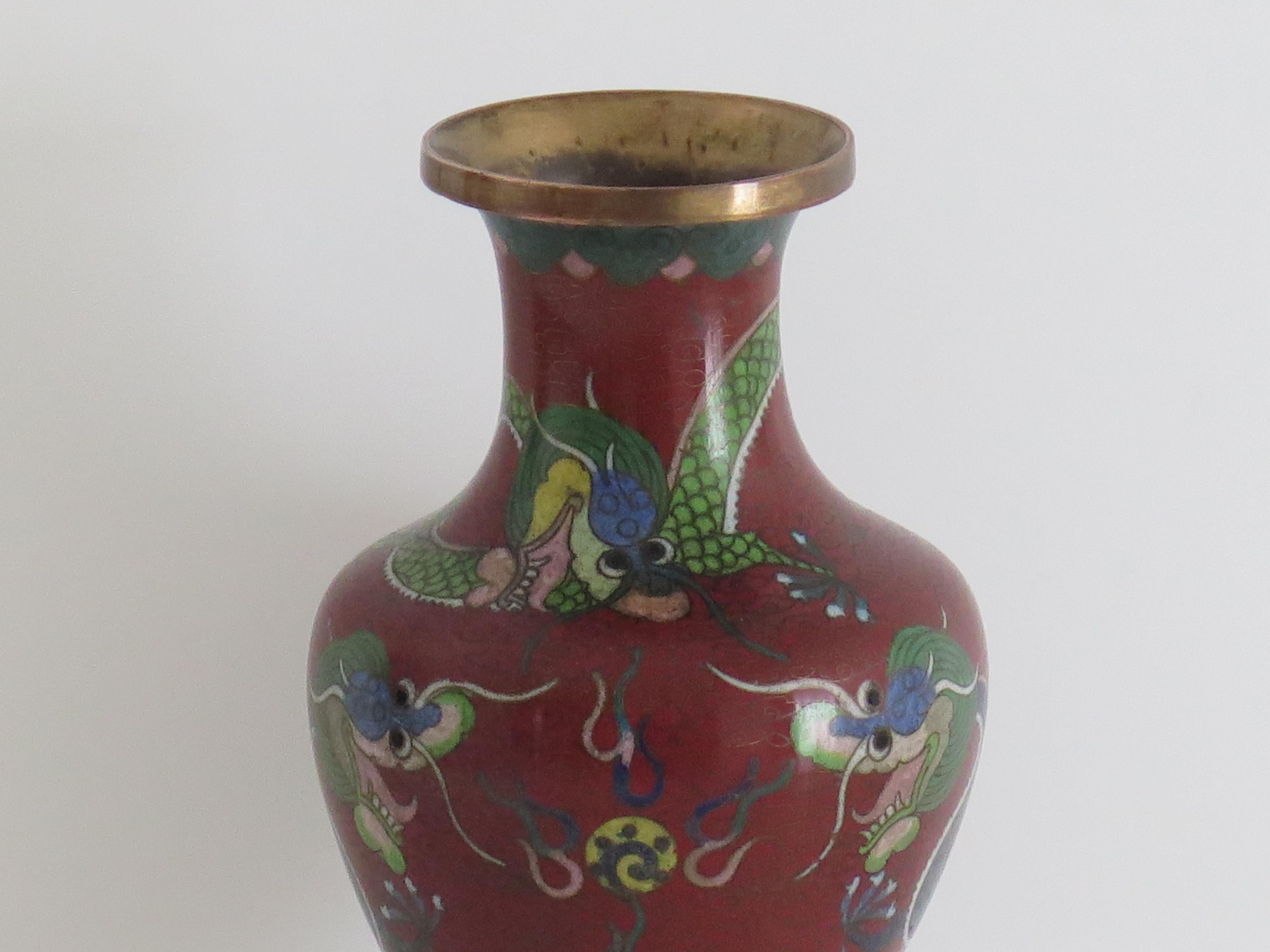 This is a very decorative mid size cloisonné vase, made in China and dating to the Chinese Republic period, Circa 1920's. 

The vase has a good baluster shape. It has been well made of a bronze alloy with rich enamels of many different colours,