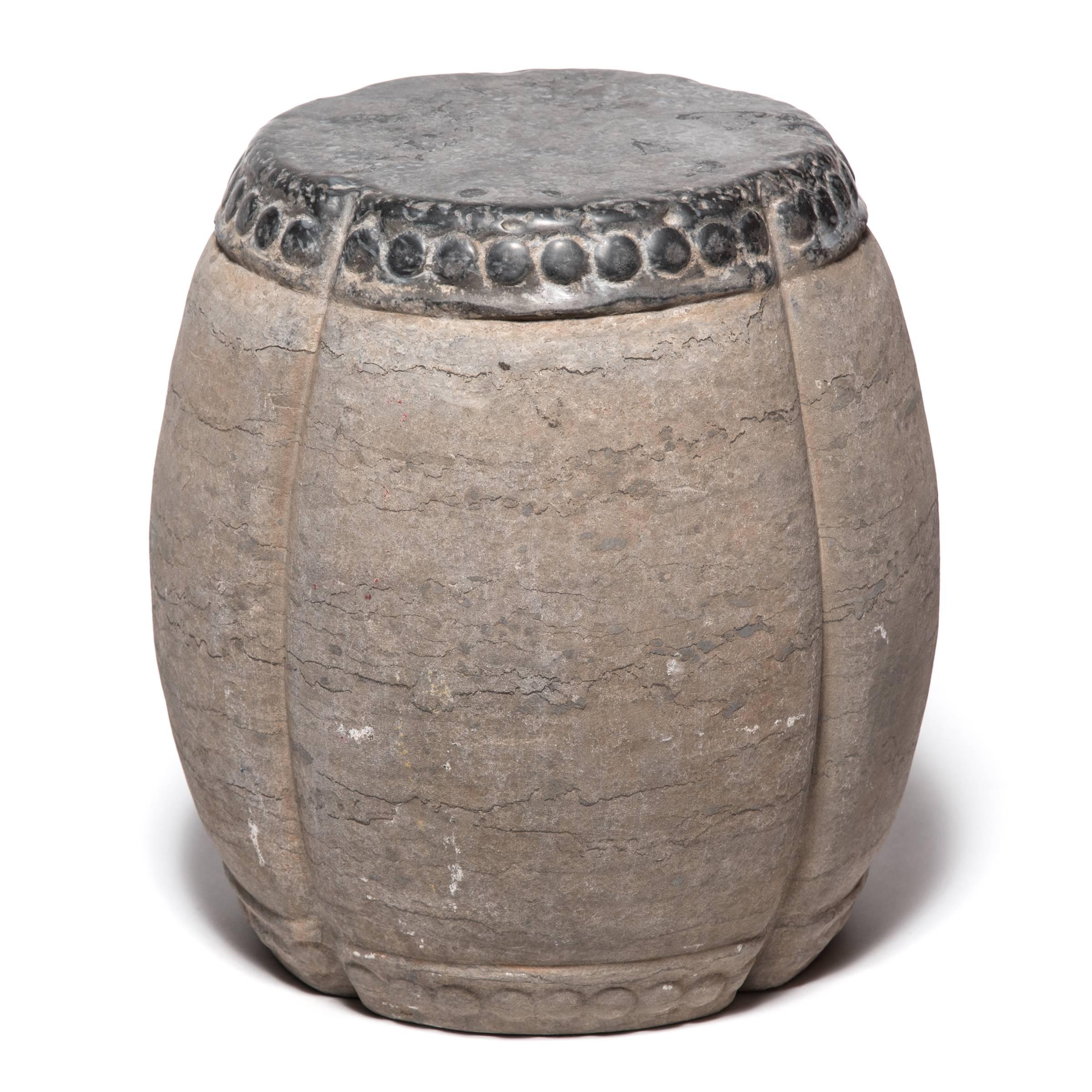 Marked by expressive veining, this handsome stool was carved in China’s Shanxi province out of a piece of solid limestone. Ribbed and rounded, the stool suggests a melon, an ancient Chinese symbol of perpetuity. Traditionally used as a place to rest