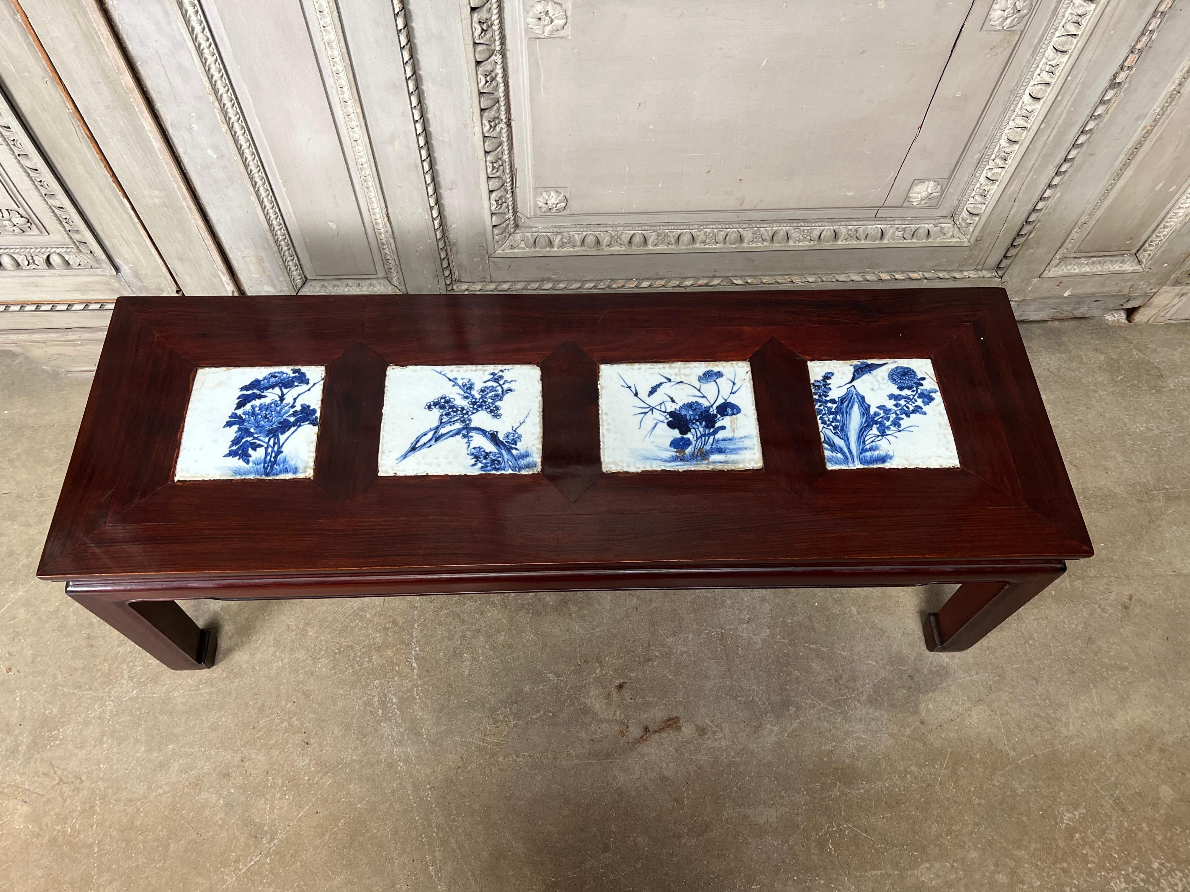 Hand-Carved Chinese Coffee Table with 19th Century Blue and White Tiles For Sale