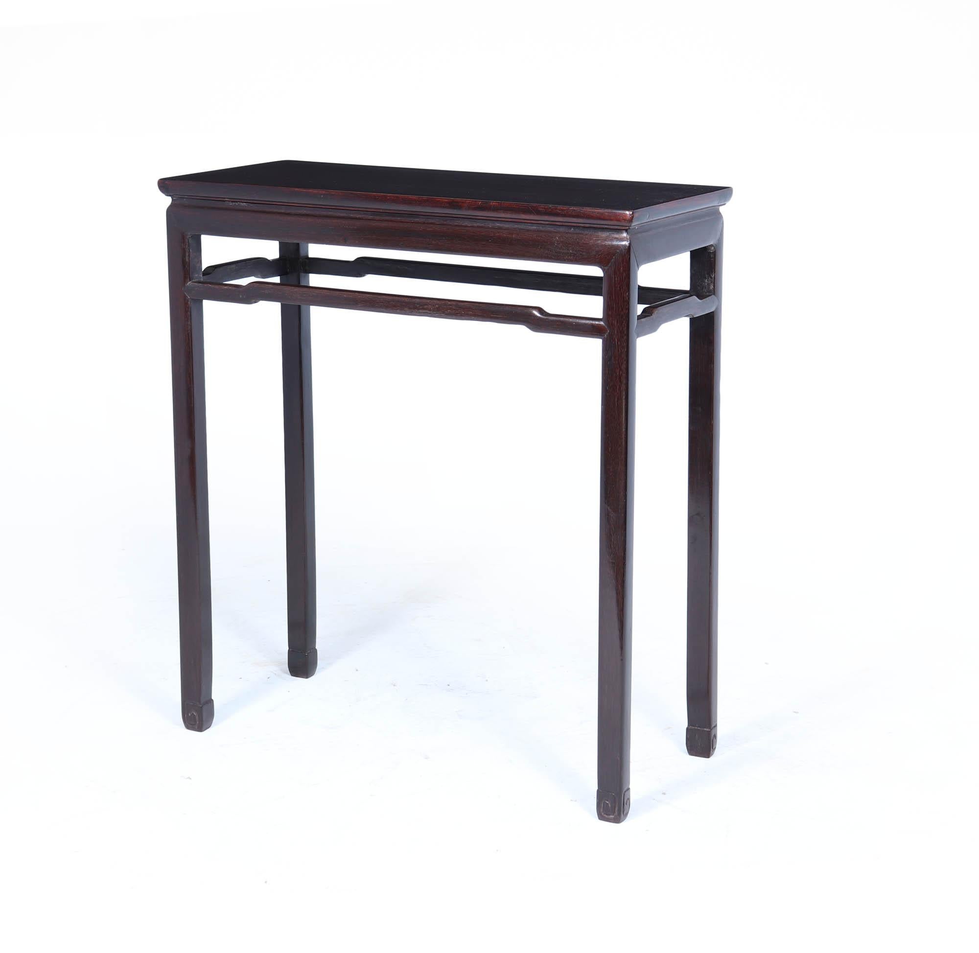 A refined and elegant Chinese hardwood console table, also known as a scroll table, dating to circa 1900. With its restrained proportions, subtle curves and finely worked details, this piece embodies the understated sophistication of traditional