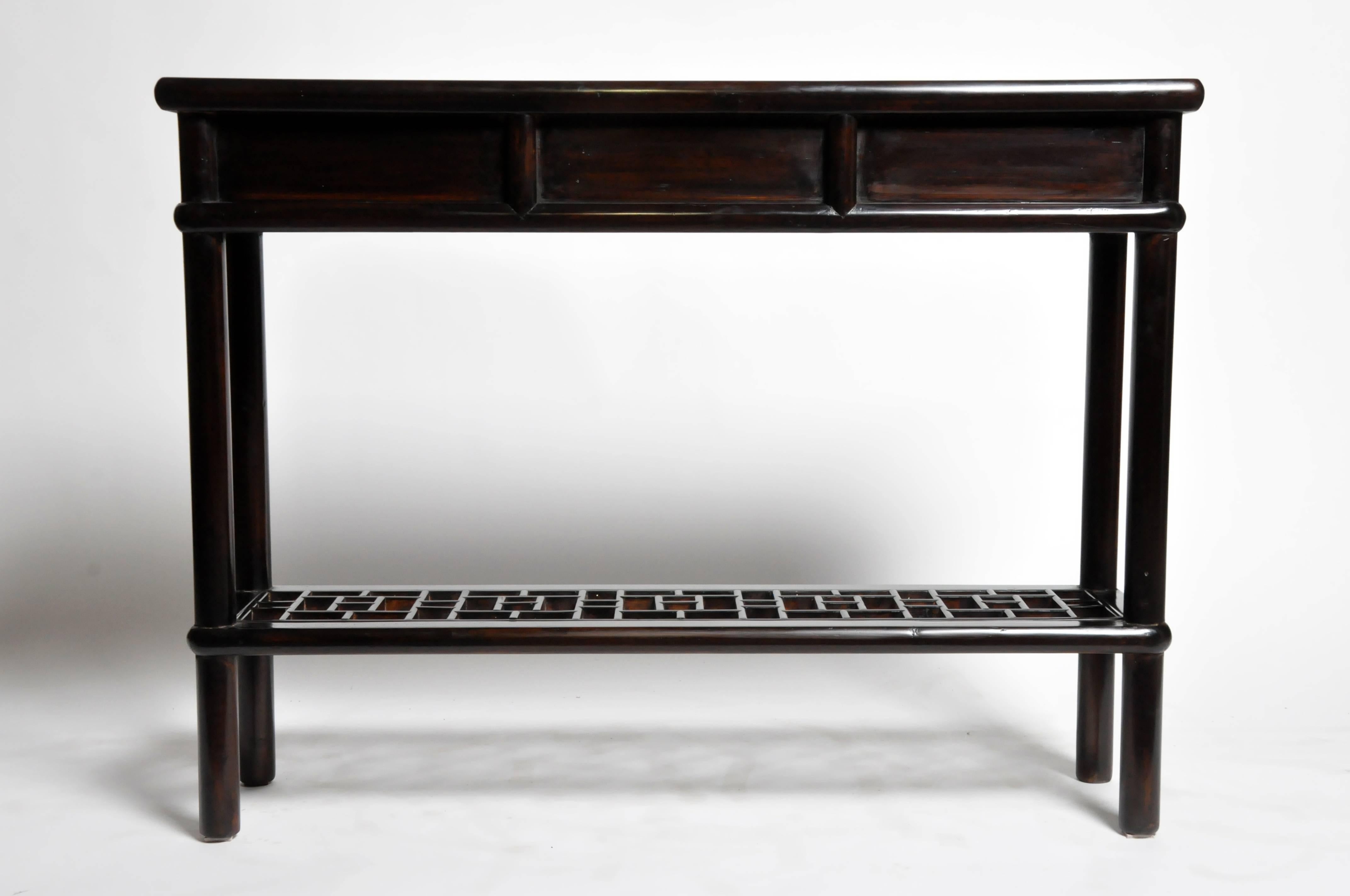 This side table is from Shanghai, China and made from reclaimed elm wood. This piece features mortise and tenon joinery, three drawers and a lattice shelf below for additional storage. You can also customize a new one and make it your own. Wood,