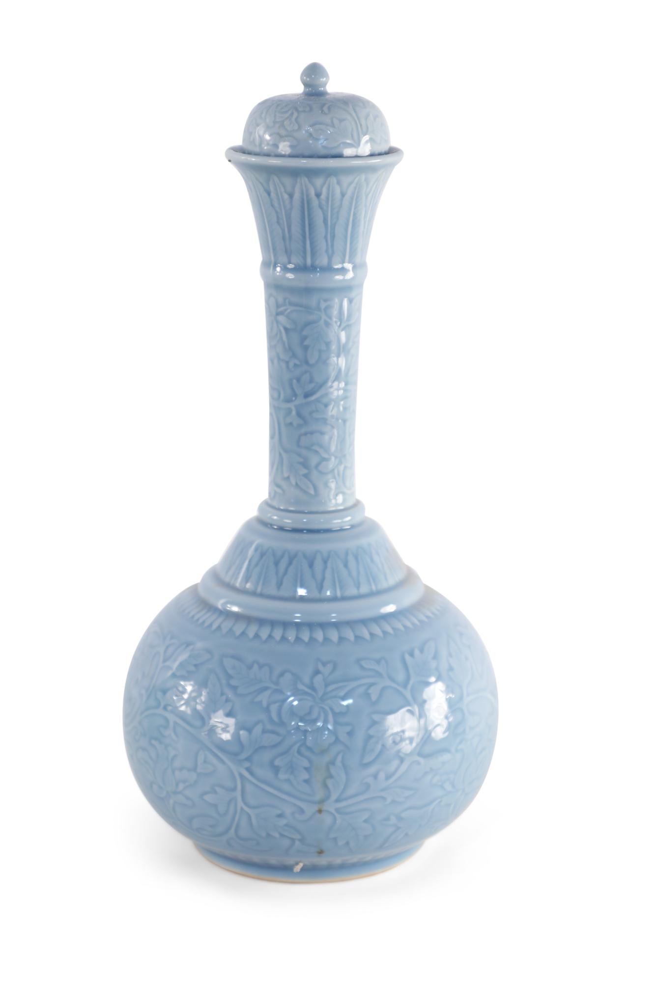 20th-Century Chinese cornflower blue porcelain vase with a gourd-shaped form wrapped in a tonal vine pattern and fitted with a ball finial-topped lid.