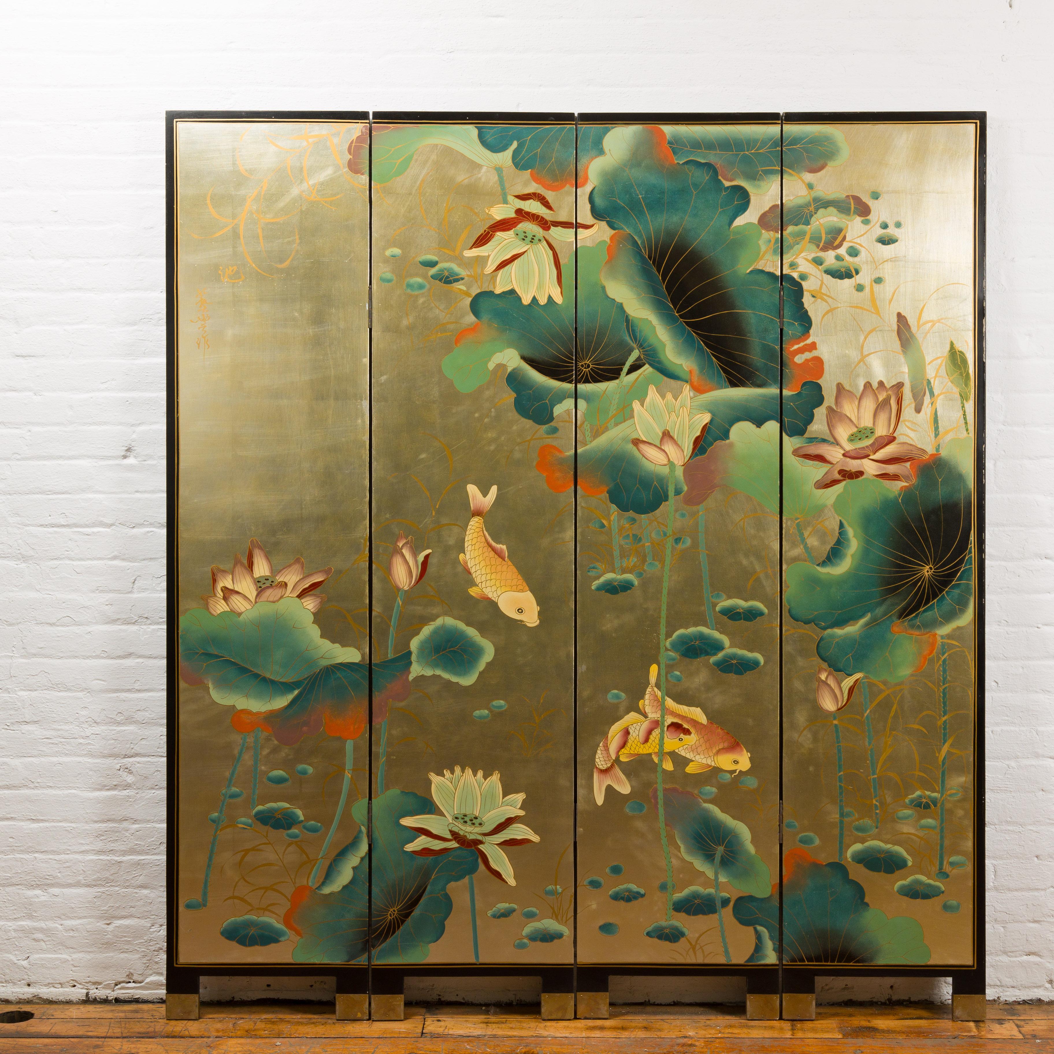 A Chinese Antique Gold Leaf Koi Fish Floor Screen and Room Divider from the mid 20th century with lotus flowers and Koi fishes. Step into an ethereal realm with this resplendent mid-20th century Chinese Export Coromandel screen, inspired by the