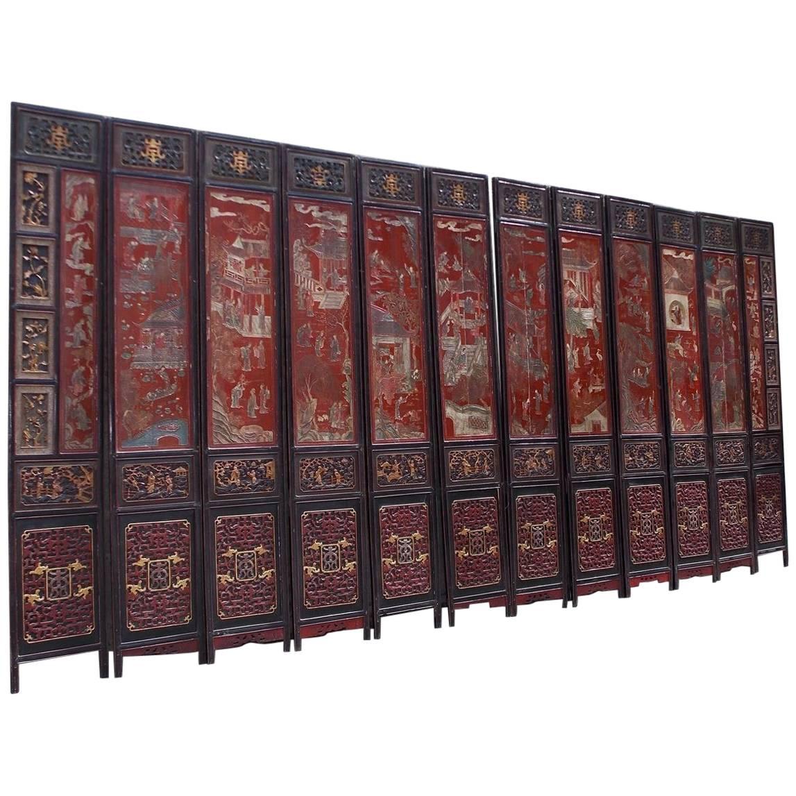 Chinese Coromandel Red Lacquer 12-Panel Figural and Landscape Screen. Circa 1840