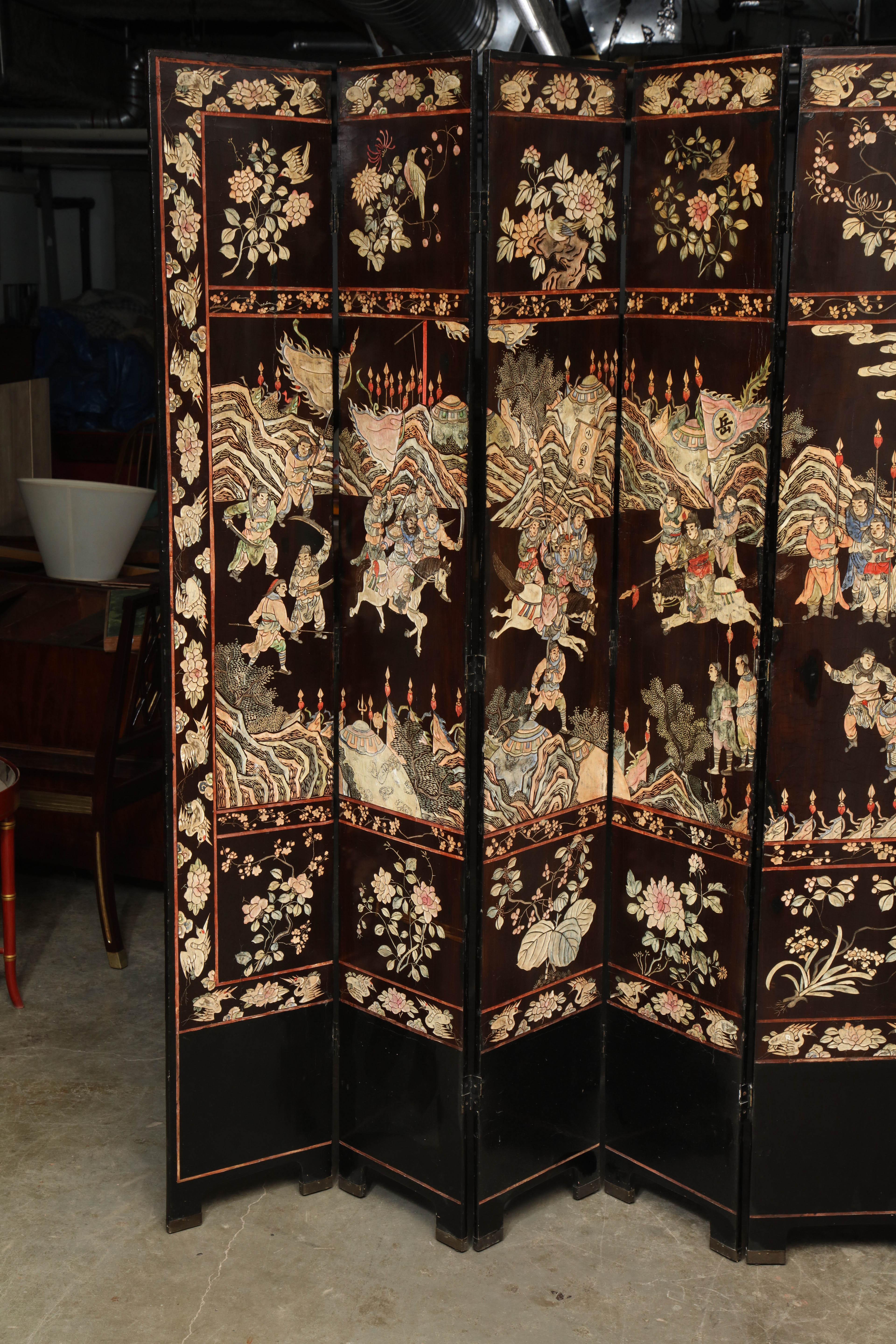 An early 19th century Chinese 8 panel carved coromandel screen.
