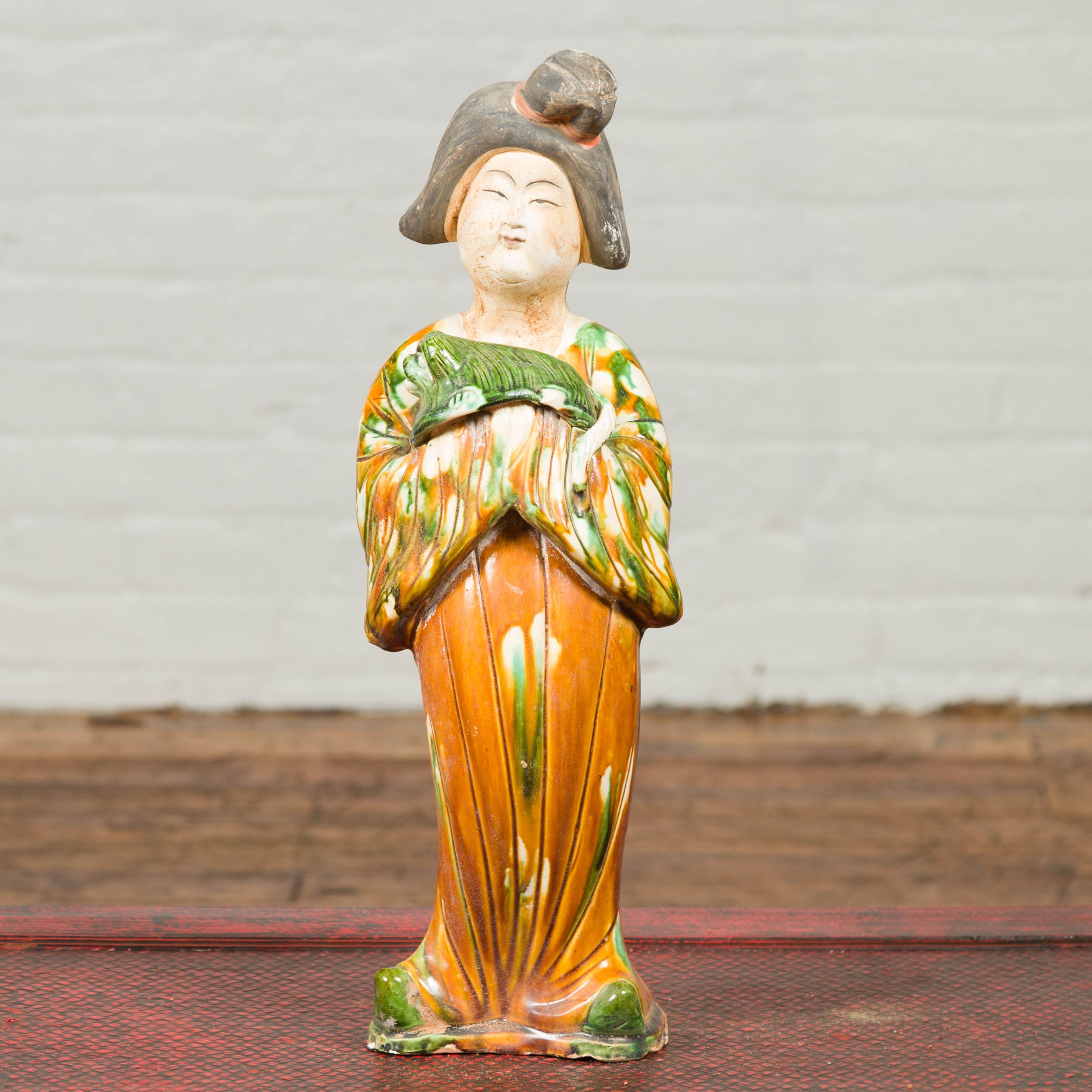 A small Chinese vintage statue of a court lady dressed in an 