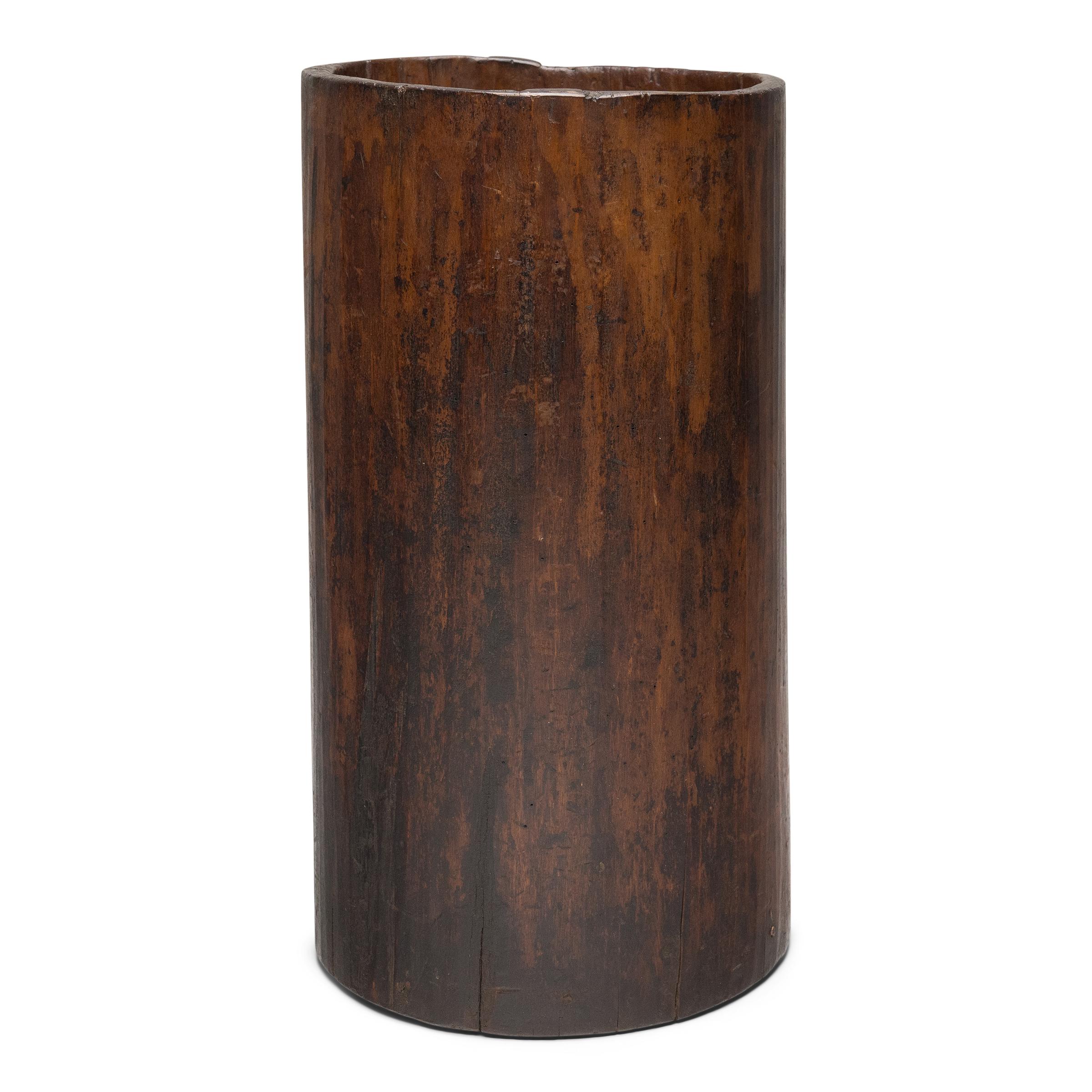 This rustic wooden container dates to the early 20th century and was once used to store dry goods or household items in a provincial home in Yunnan province. Hollowed from a single tree trunk, the wide container has an organic, asymmetrical form and