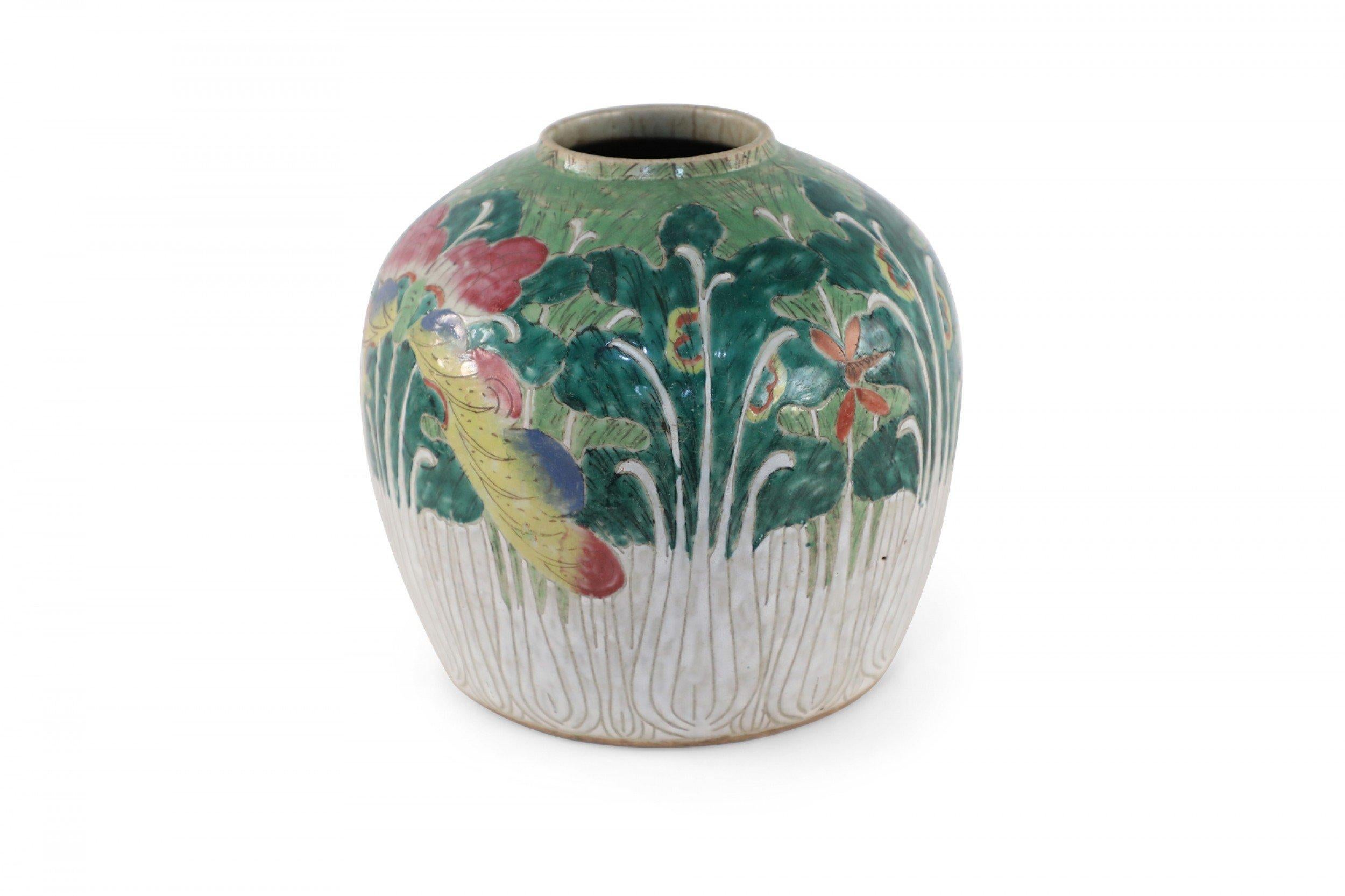 Antique Chinese (early 20th century) round porcelain vase with a small mouth opening and cream, lined design on the bottom half that grows into lush, green vegetation on the top.
      