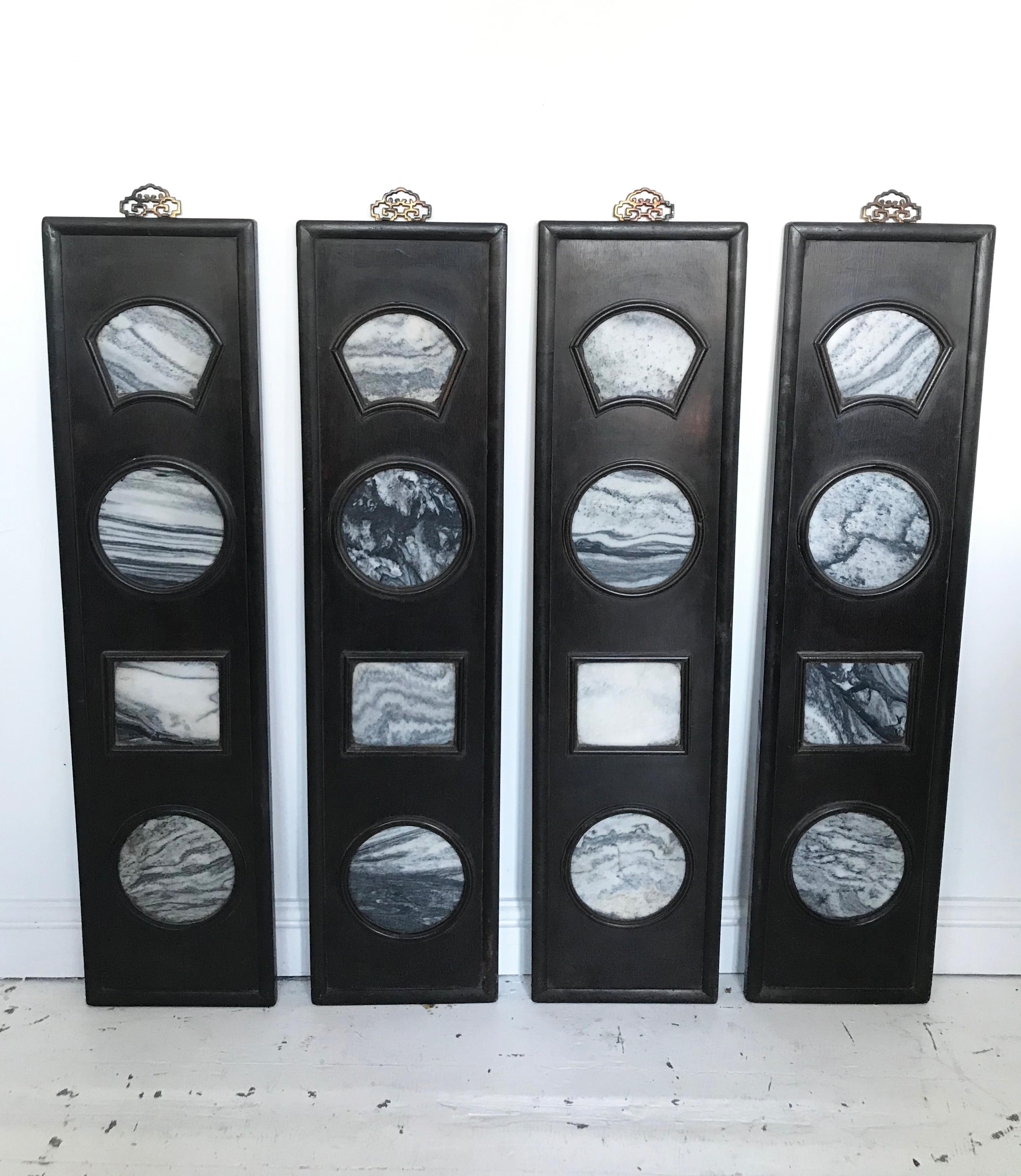 This is a set of four antique Chinese Dali stone panels which depict wonderful landscape images. The stone is set in an ebonized panel frame. They look wonderful grouped together on the wall.