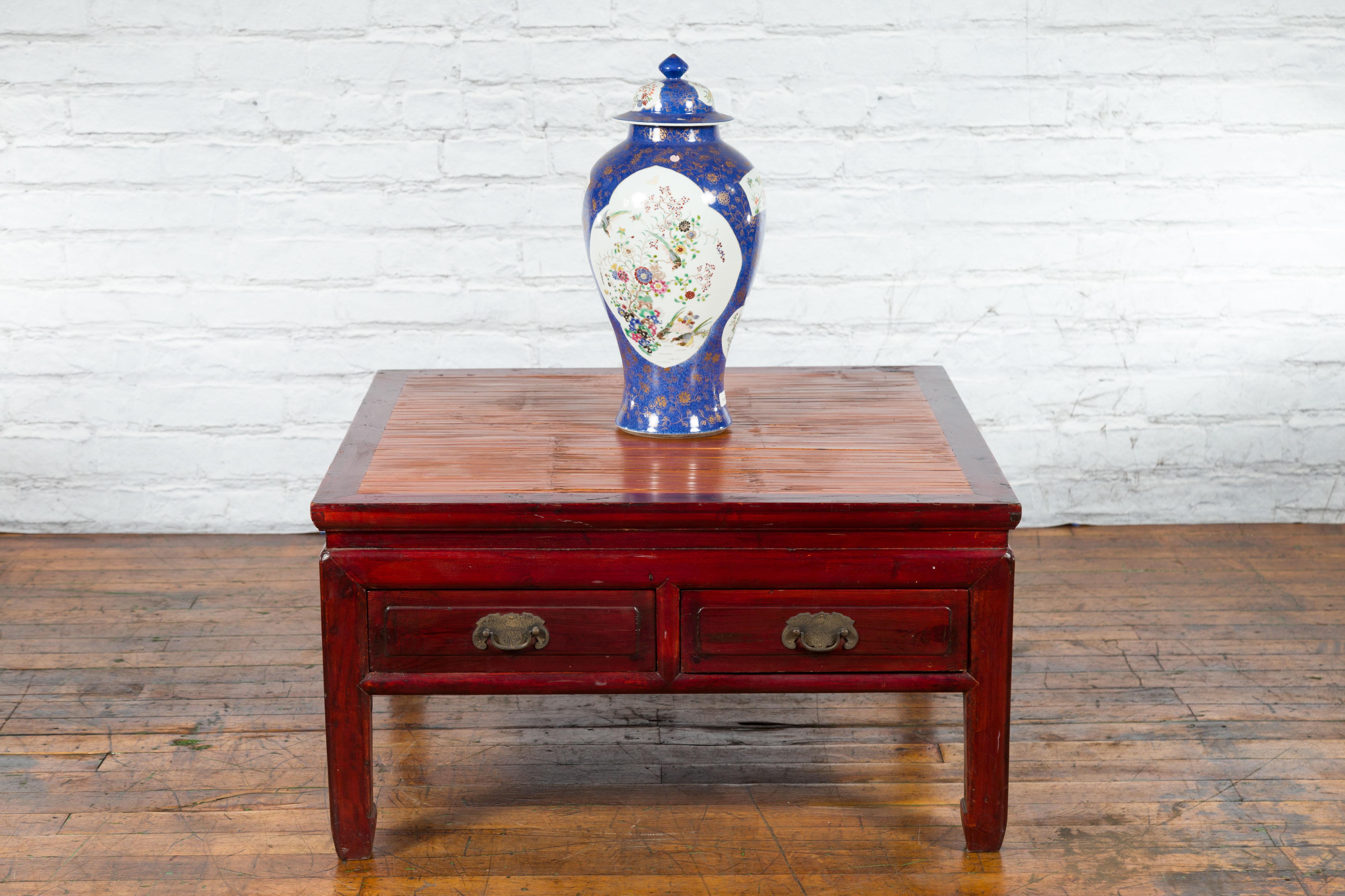 Chinese Dark Red Lacquered Coffee Table with Bamboo Top and Long Drawers In Good Condition For Sale In Yonkers, NY