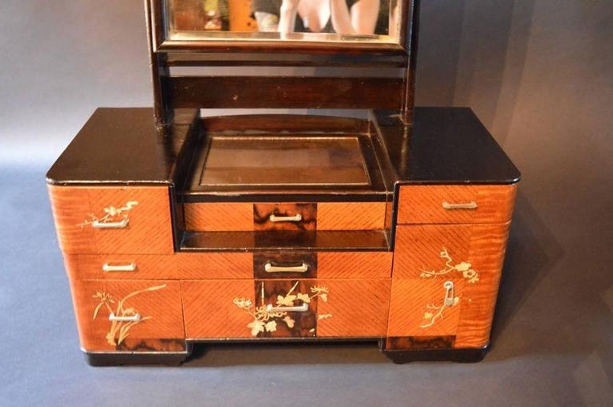 Chinese deco vanity. Top above drawers is mirrored. Mother-of-pearl details.