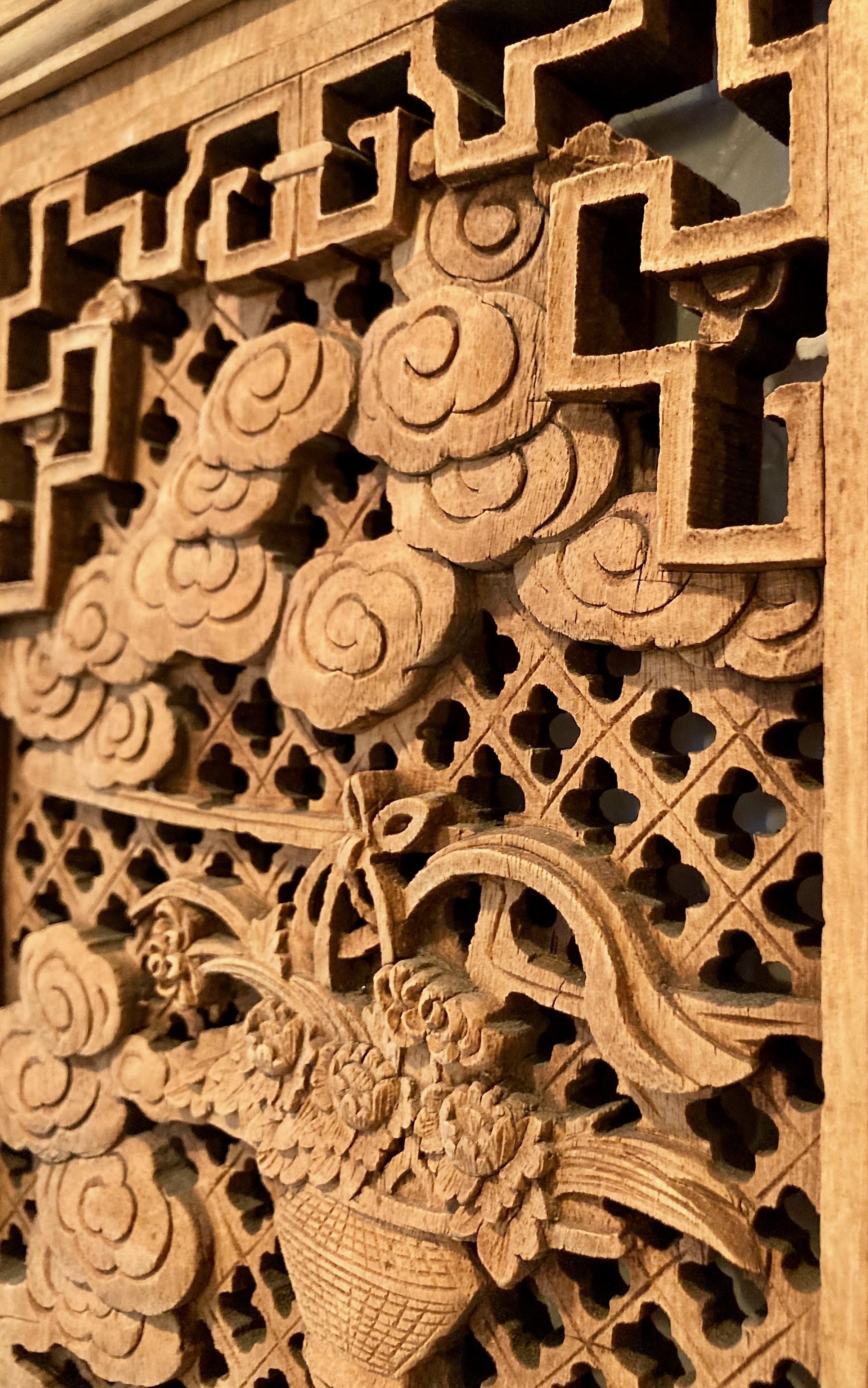 The wonderful design in this framed panel includes personage carvings with surrounding tree, floral and dwelling motifs.