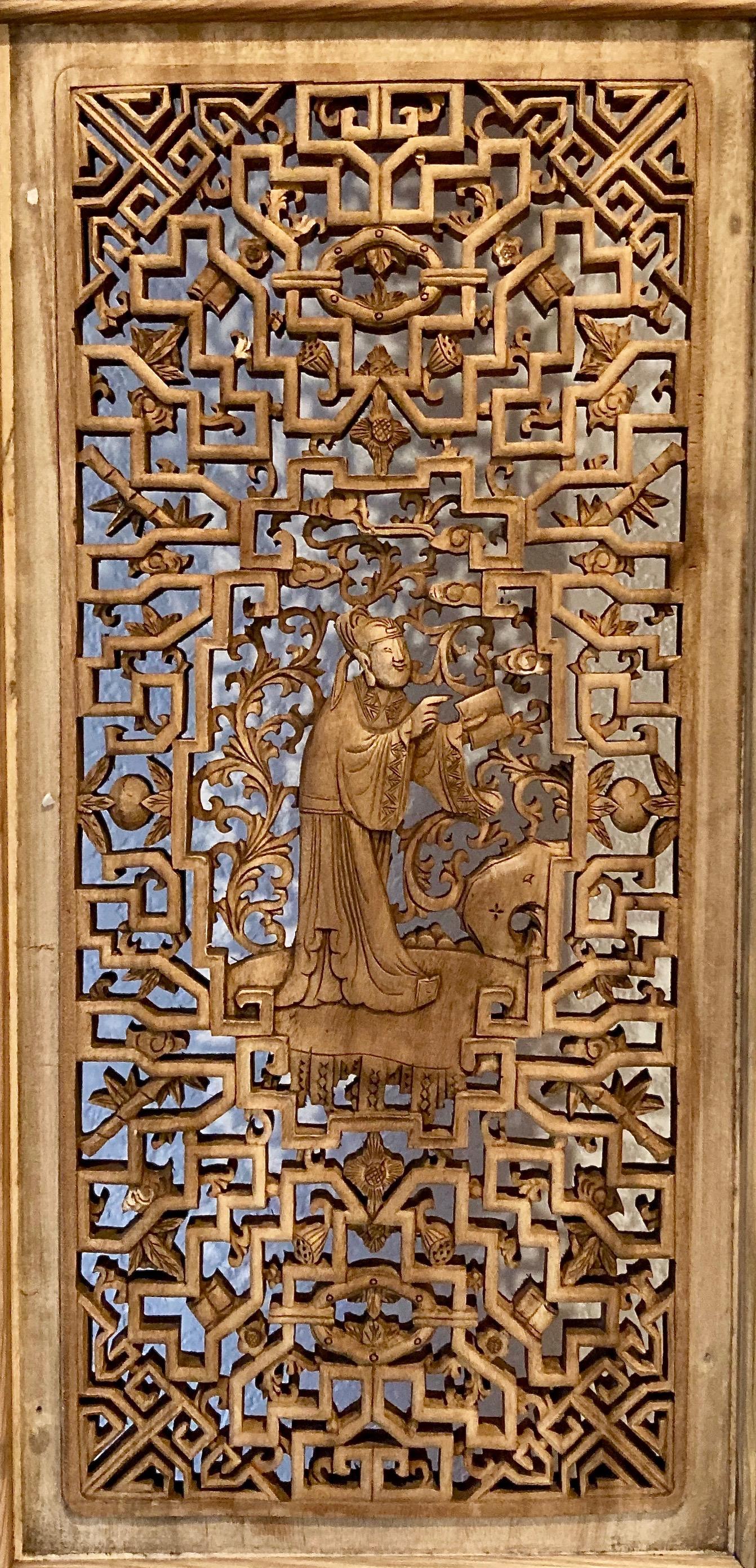 Framed panel with four panes, openwork and relief carvings. Intricate design, main pane openwork with personage, book in hand. Nice lower relief carving with phoenix and plant motif.