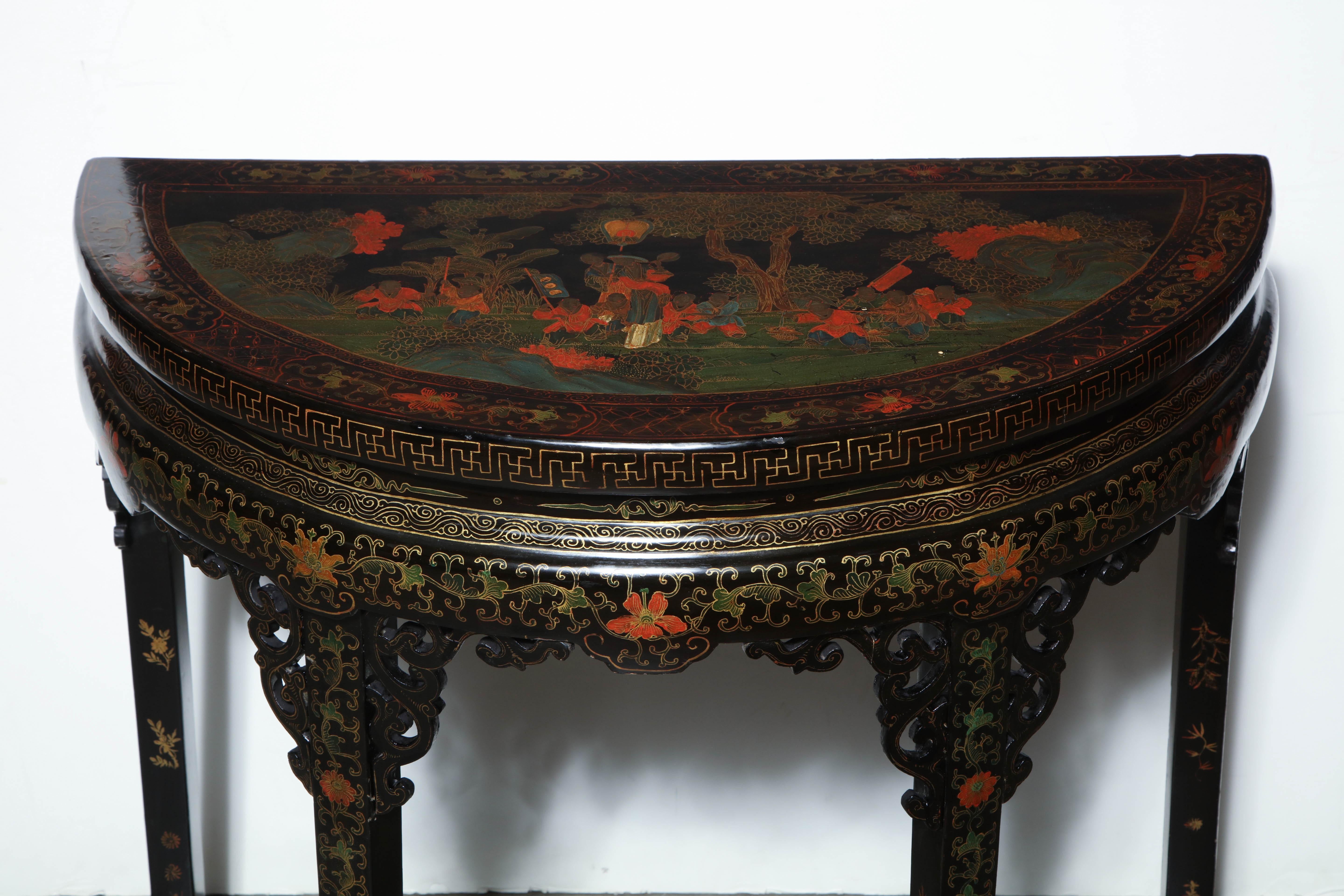 Chinese black lacquered and chinoiserie decoarted demilune console table with flat stretcher base.