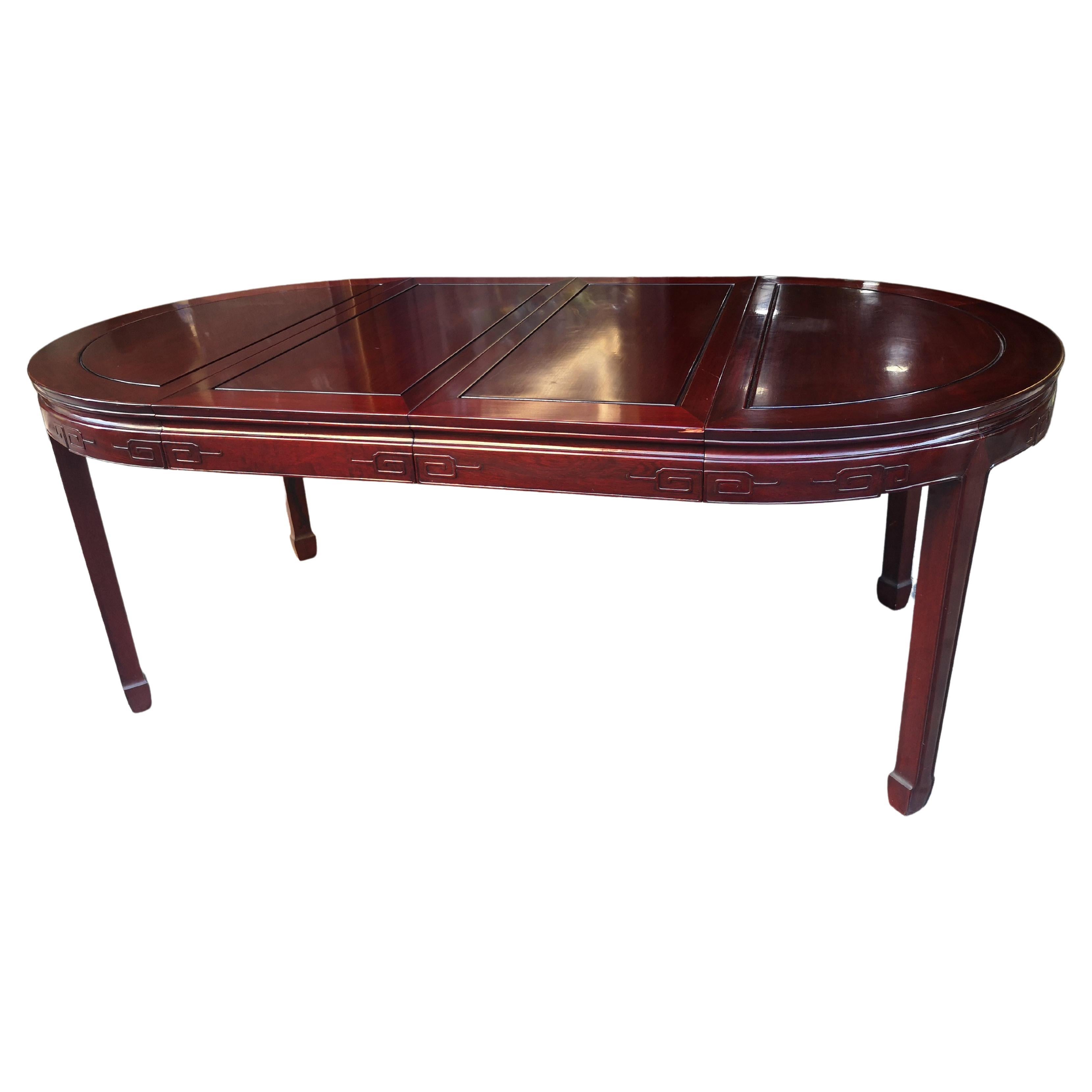 Chinese dining table 112 cm in mahogany from the 1970s with 2 extensions 204 cm For Sale