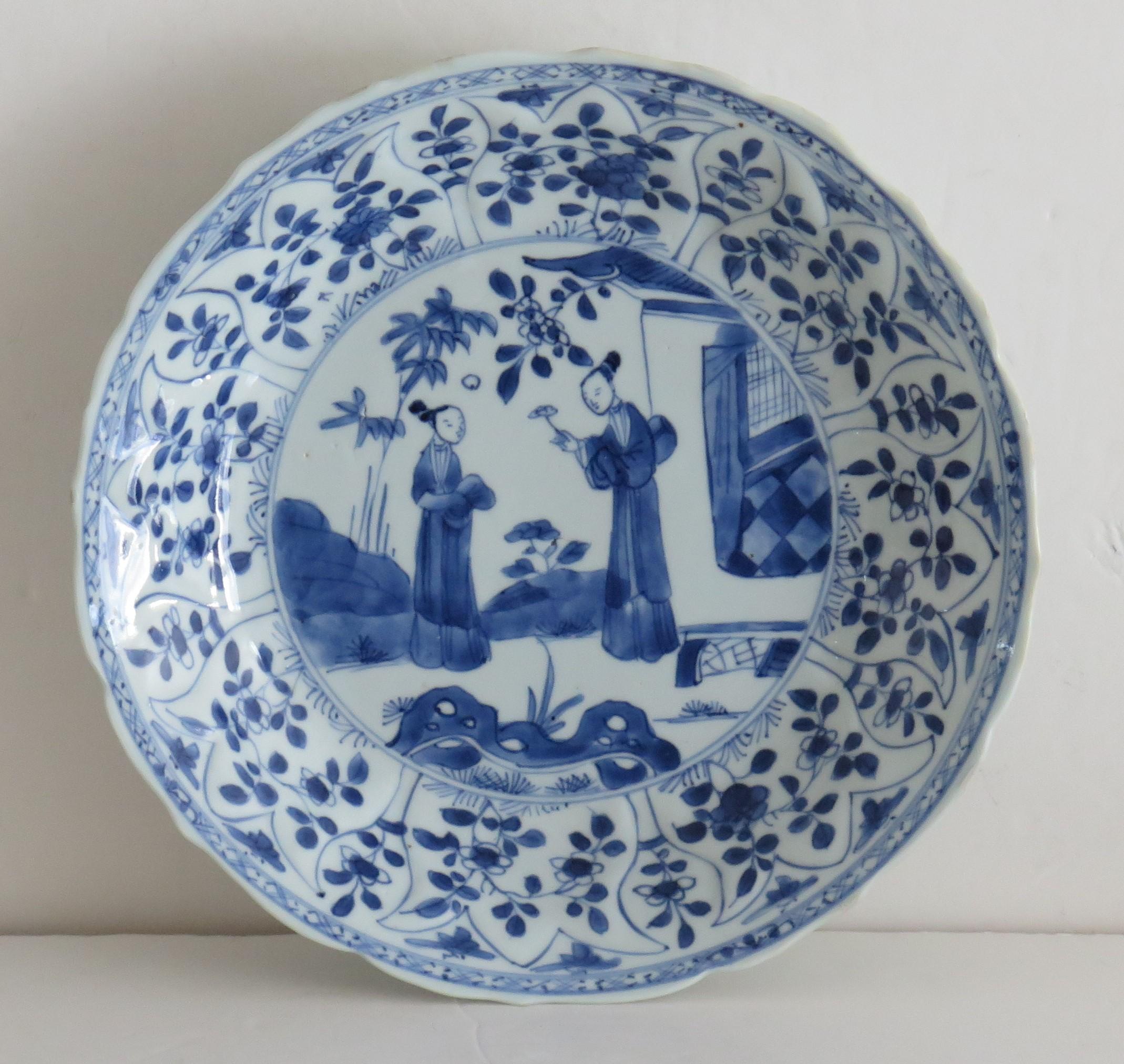 This is a very beautifully hand painted Chinese porcelain blue and white Dish or Plate from the early 18th Century Qing period, either late Kangxi period ( 1662-1722) or Yongzheng period (1723-35).

This is a well potted dish with 8 lobes or ribs,