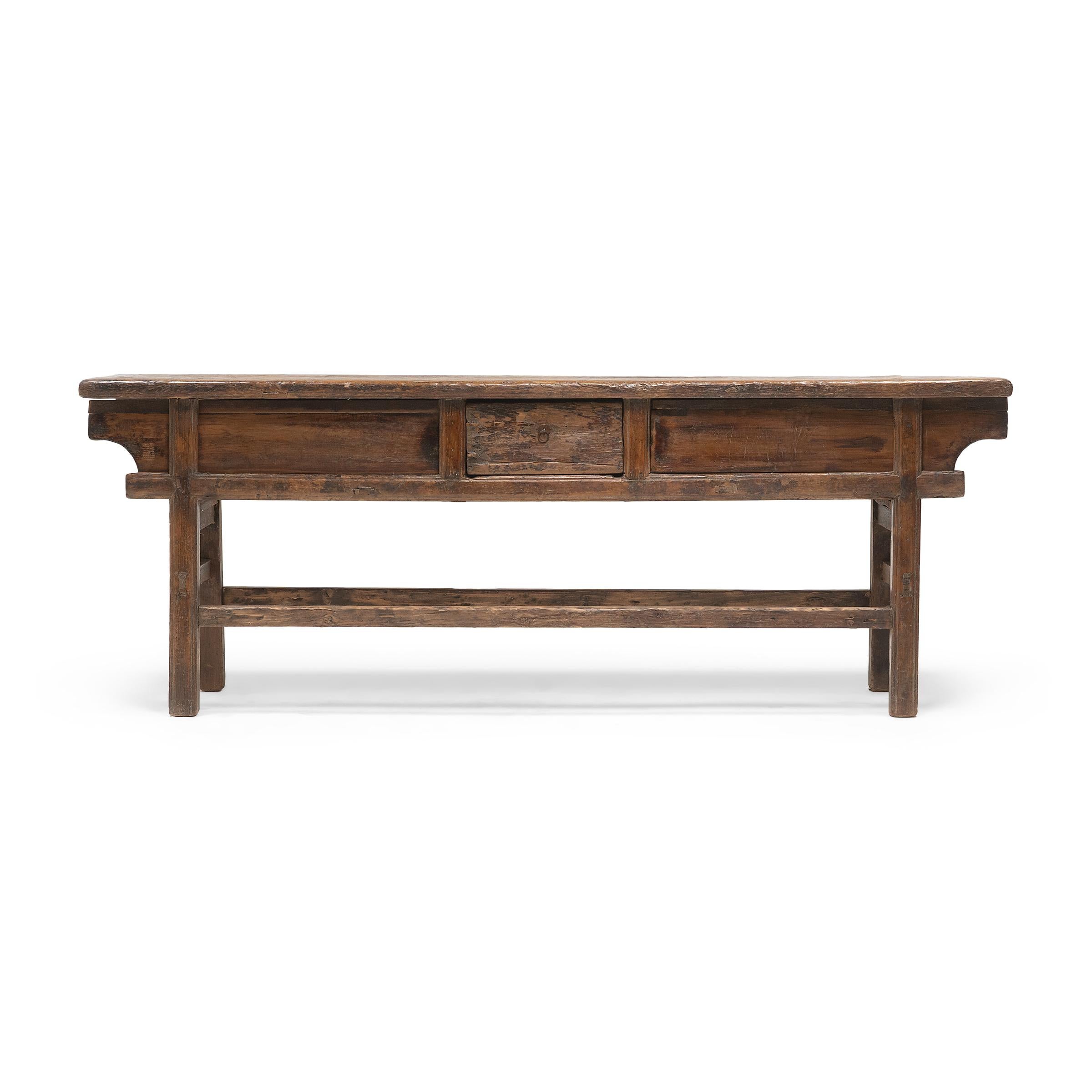 The warm tones and active grain of natural pine wood are the focus of this unusually articulated buffet. Made for a provincial home in northeastern China, this buffet was once used to honor loved ones past and present with photos or other prized
