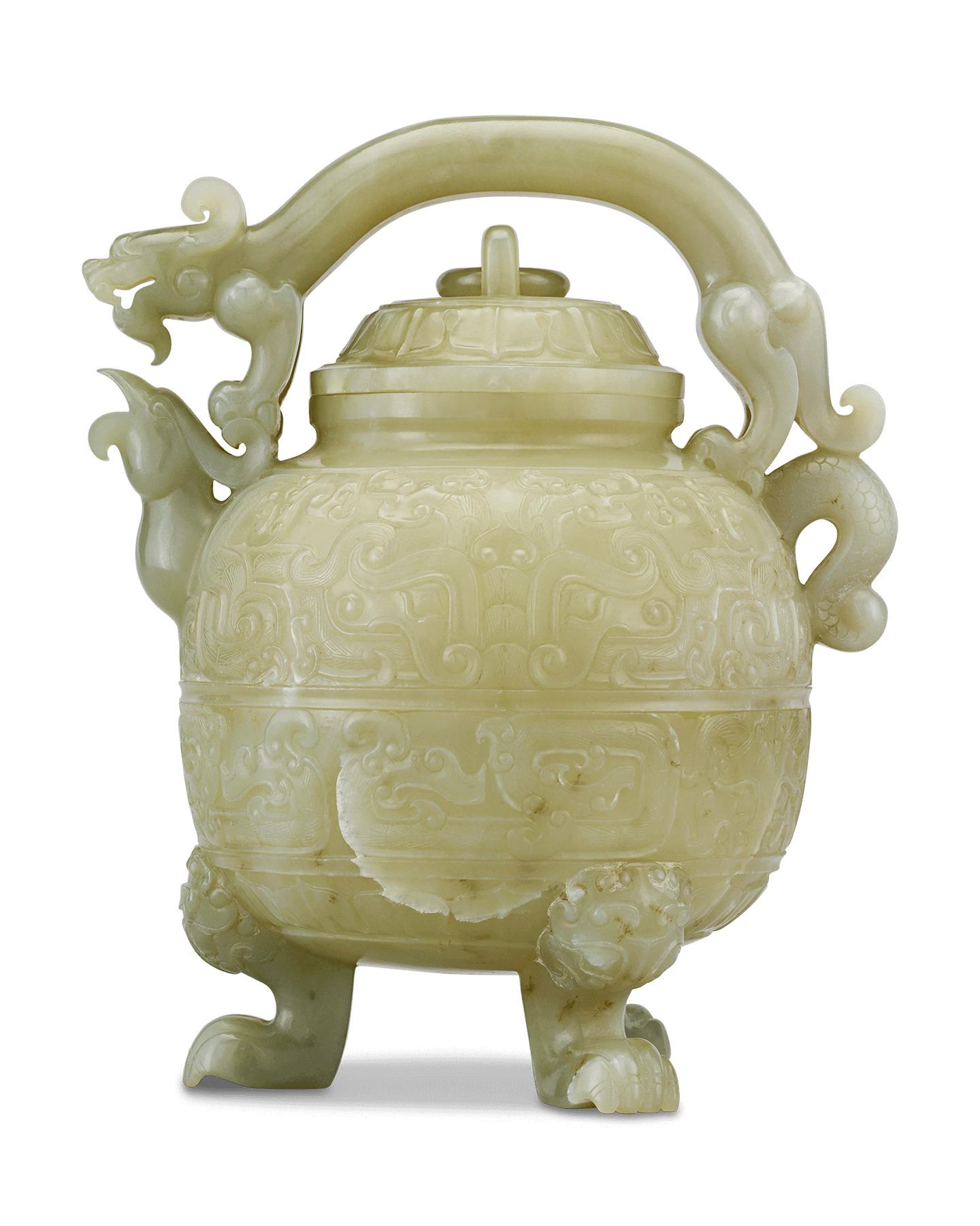 Outstanding in artistry and design, this absolutely gorgeous Chinese teapot is crafted entirely of green celadon jade, a favorite material in Asian decorative arts. A bevy of mythic motifs of Chinese iconography and folklore adorn this beautiful