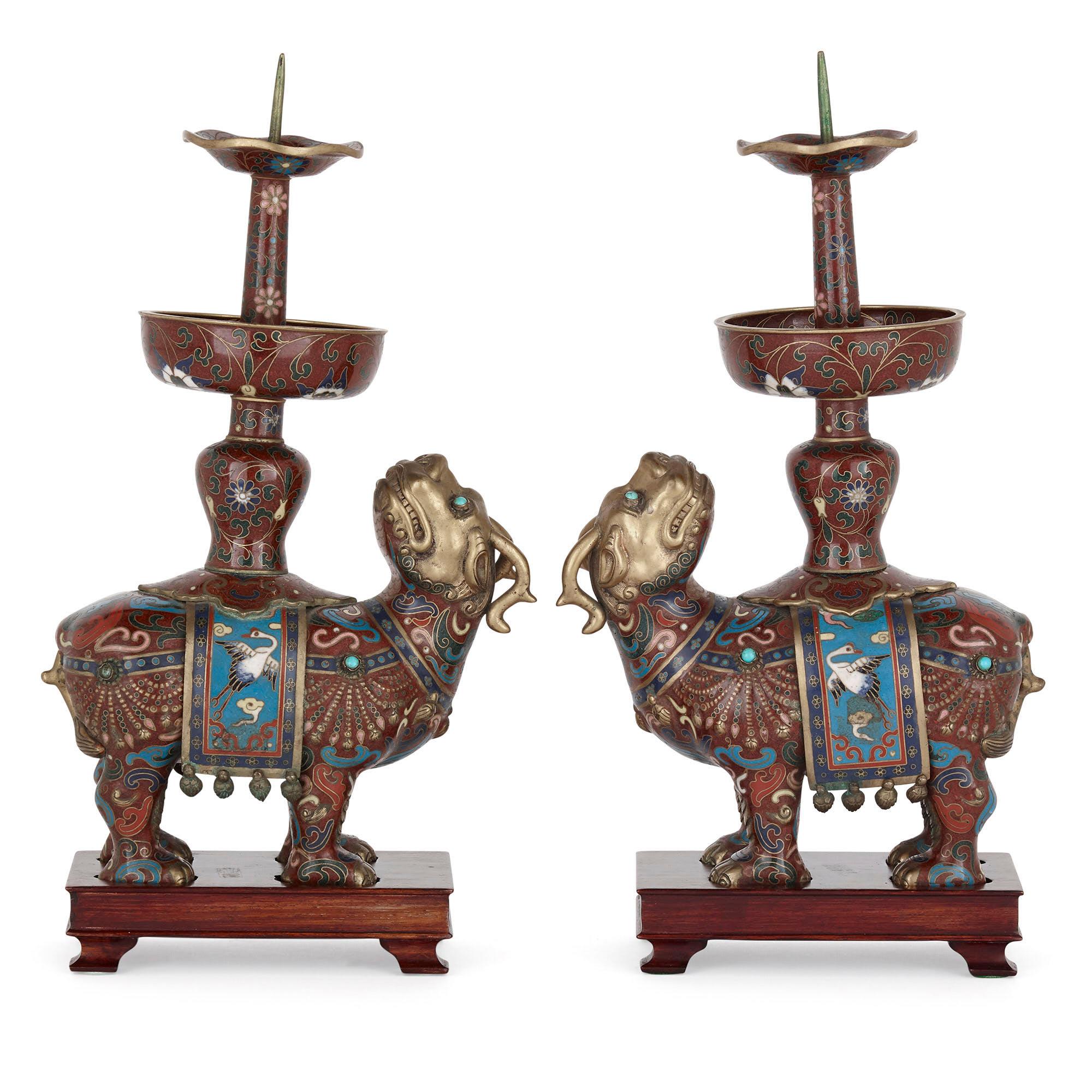 Chinese dragon-form cloisonné enamel candelabra
Chinese, early 20th century
Measures: Height 31cm, width 16cm, depth 19cm

This unusual pair of candelabra, or candlesticks, is a superb example of Chinese decorative art. Each candlestick features