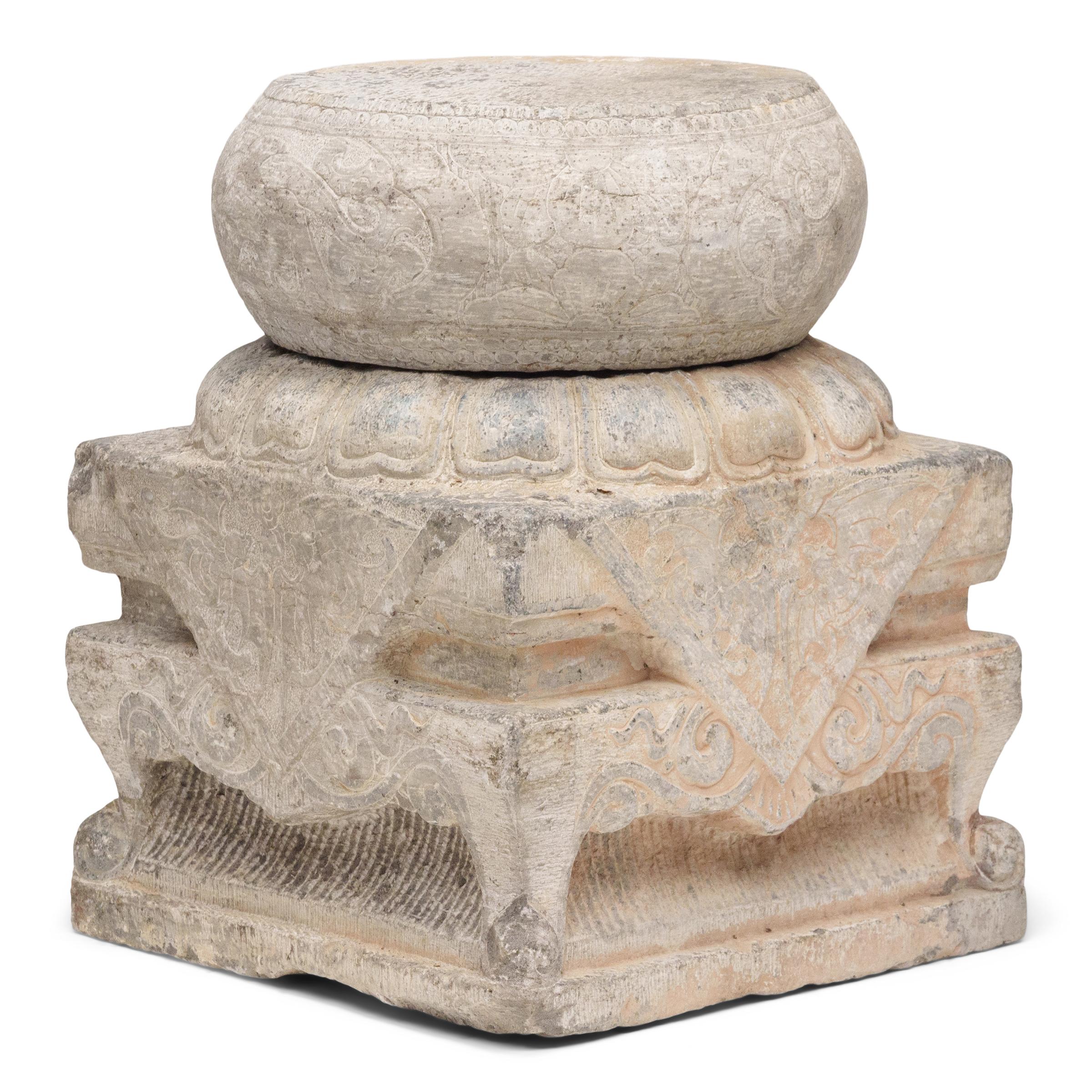 This 19th-century column base likely figured into the grand and imposing surroundings of a Qing-dynasty courtyard, supporting a large wooden beam that flanked an entry or walkway. Shaped from solid limestone, the column base has a two-piece,
