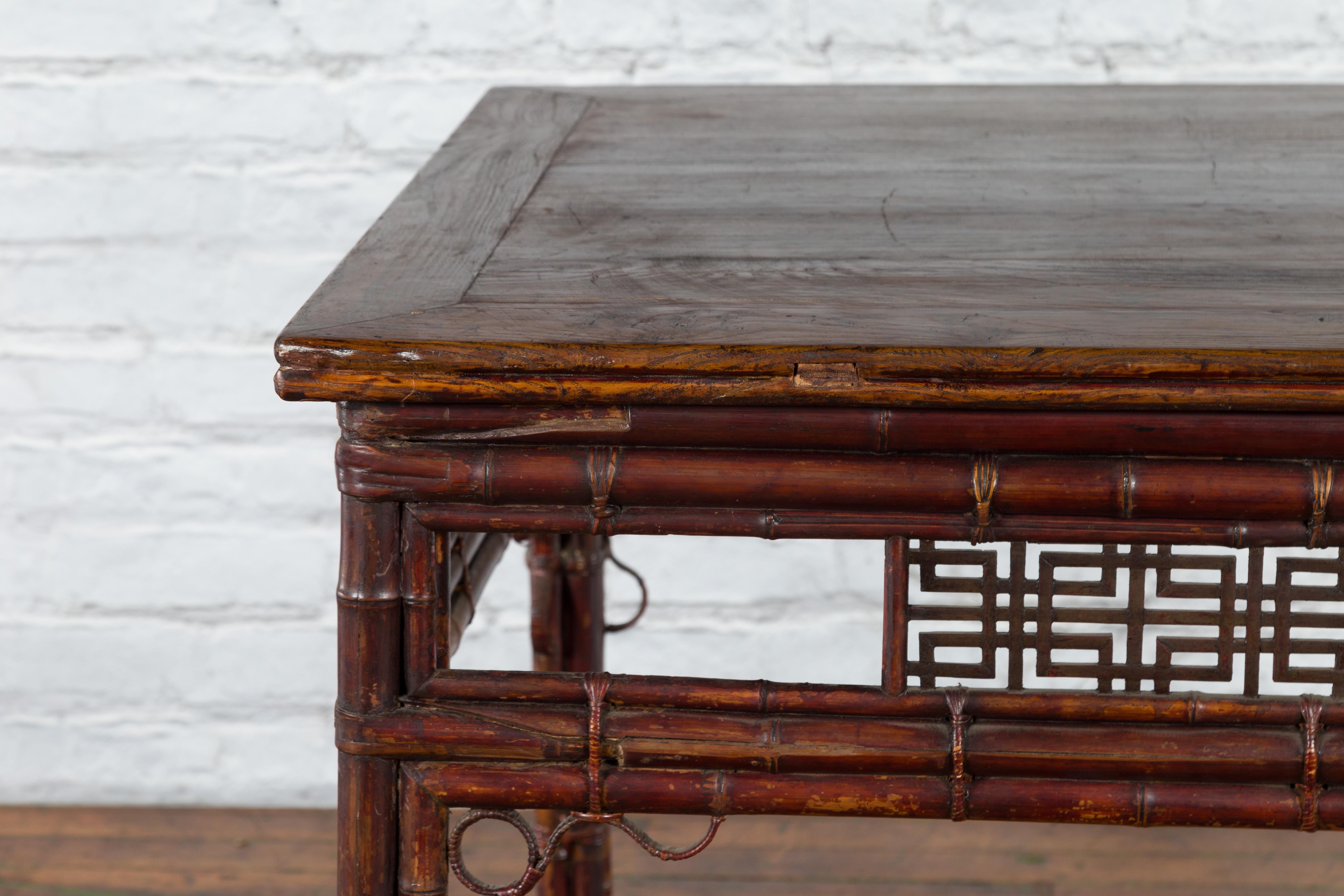 Chinese Early 20th Century Bamboo and Elm Wine Table with Rattan Looping Accents For Sale