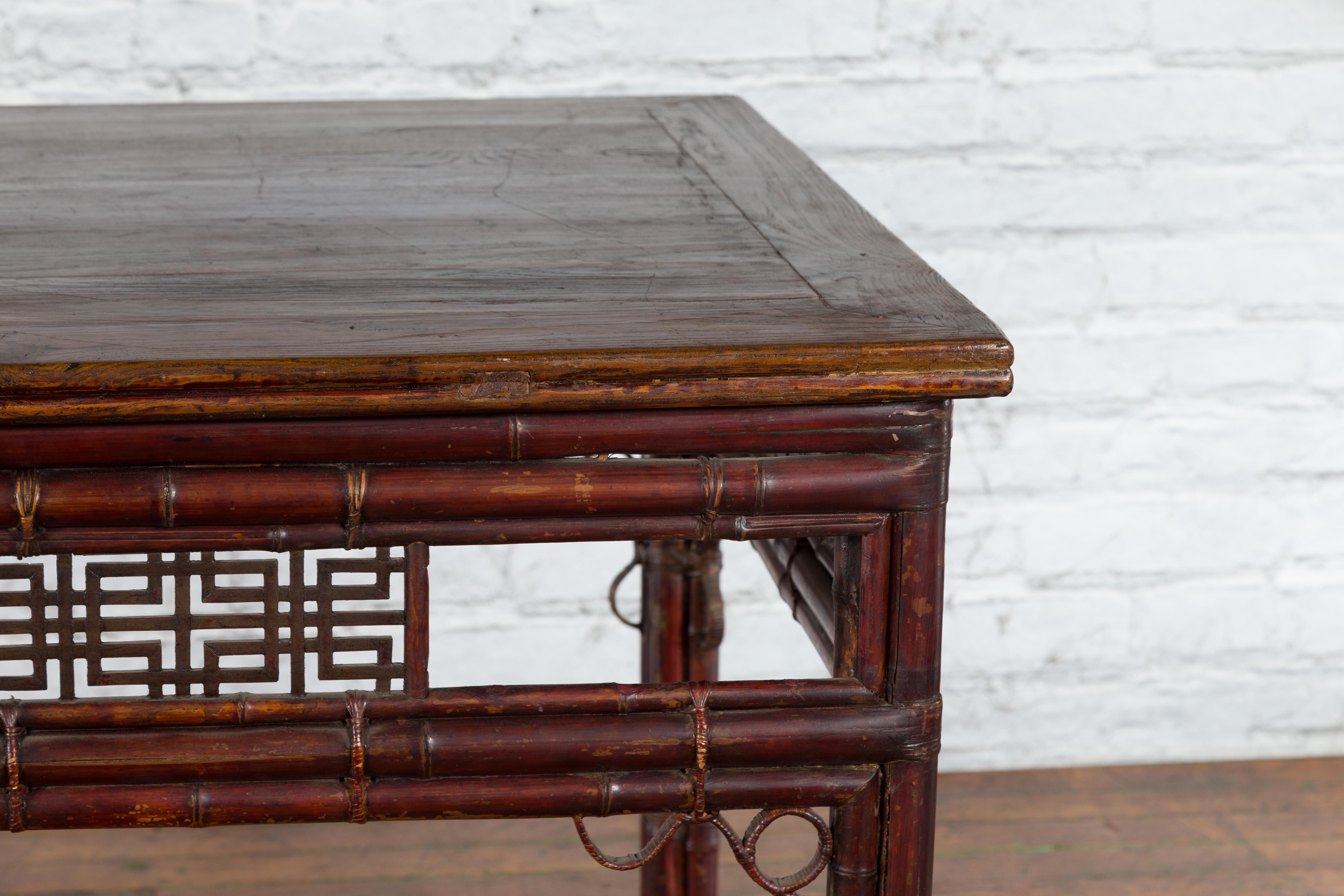 Chinese Early 20th Century Bamboo and Elm Wine Table with Rattan Looping Accents In Good Condition For Sale In Yonkers, NY