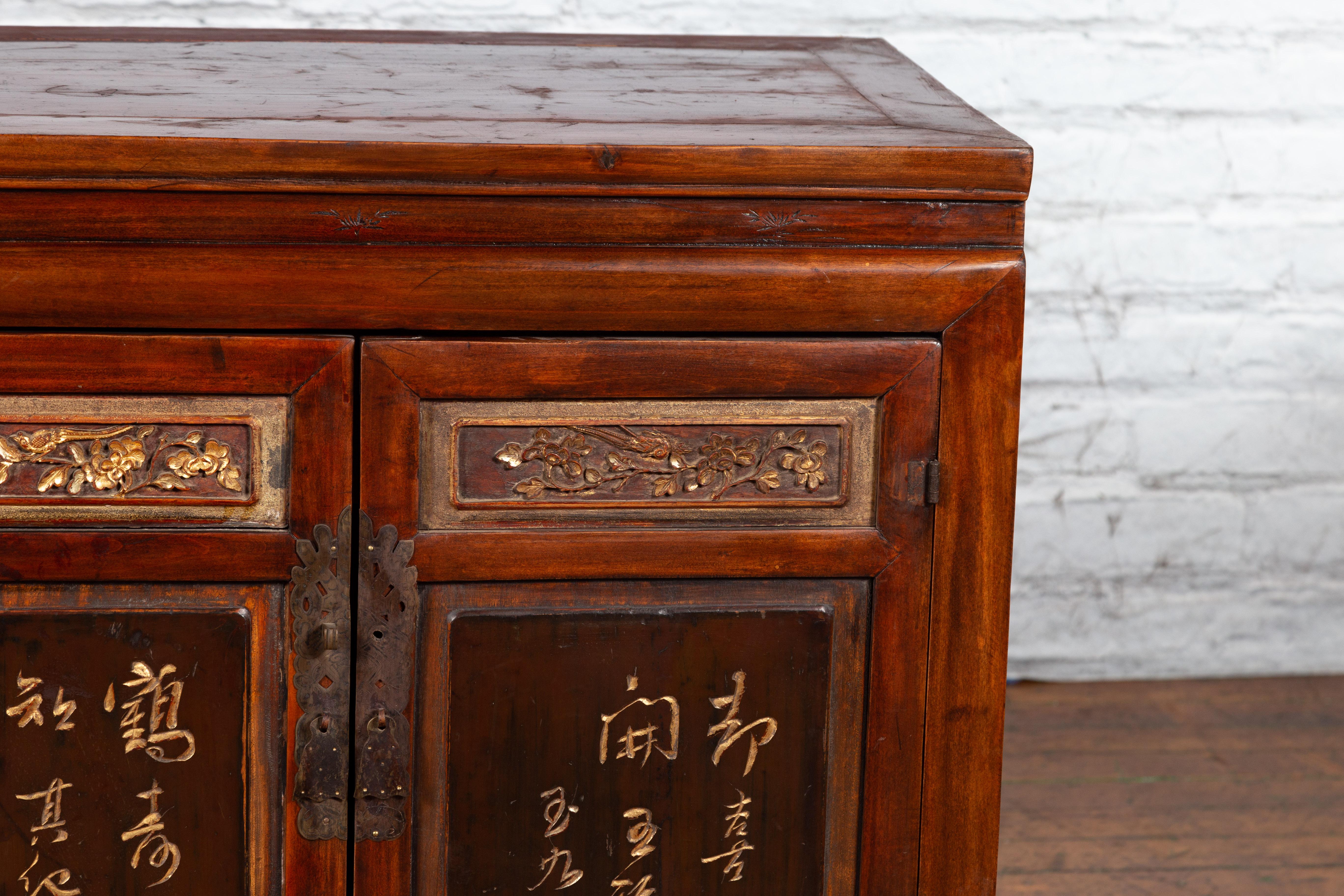 Chinese Early 20th Century Cabinet with Carved Gilded Flowers and Calligraphy 7