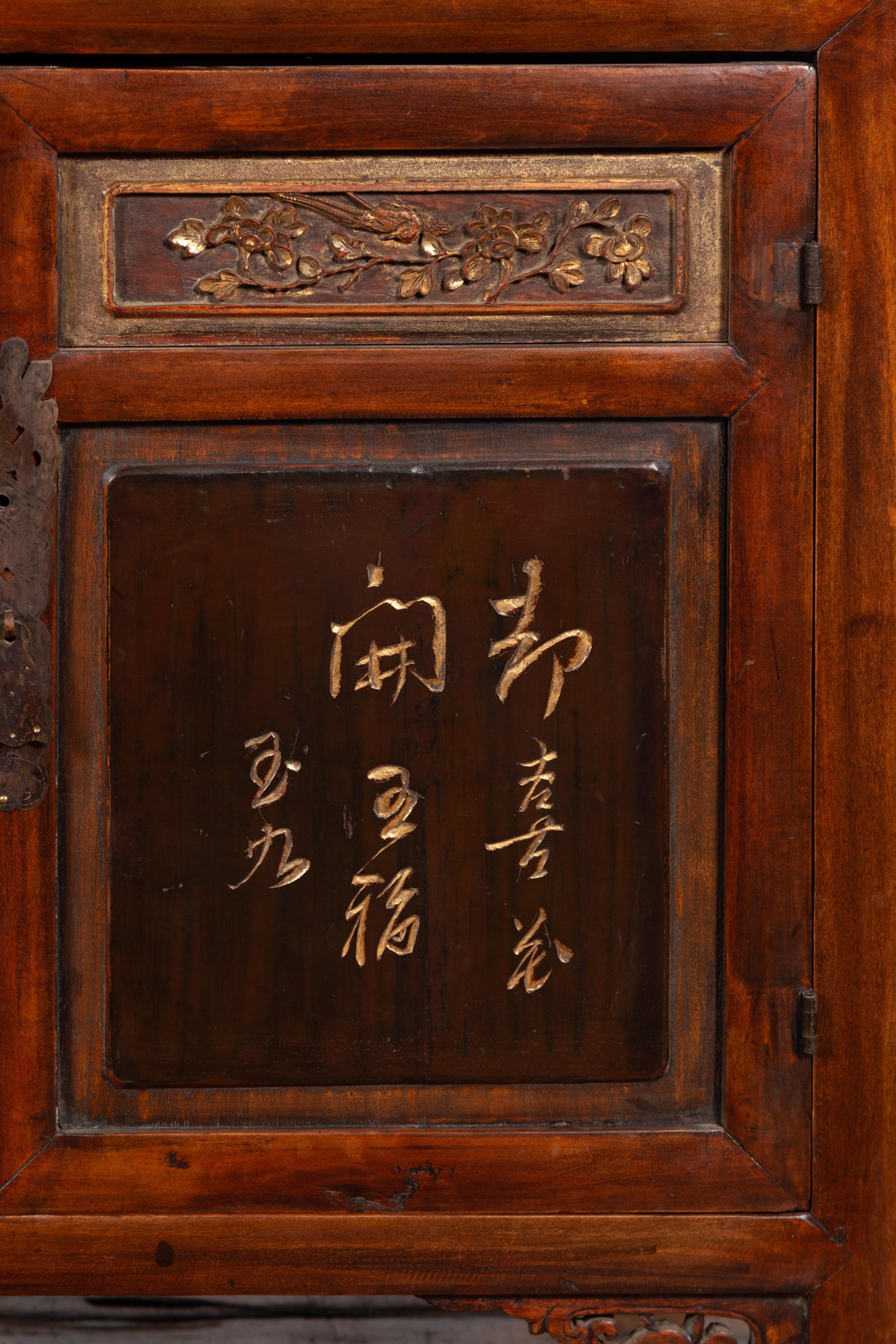 Chinese Early 20th Century Cabinet with Carved Gilded Flowers and Calligraphy 9
