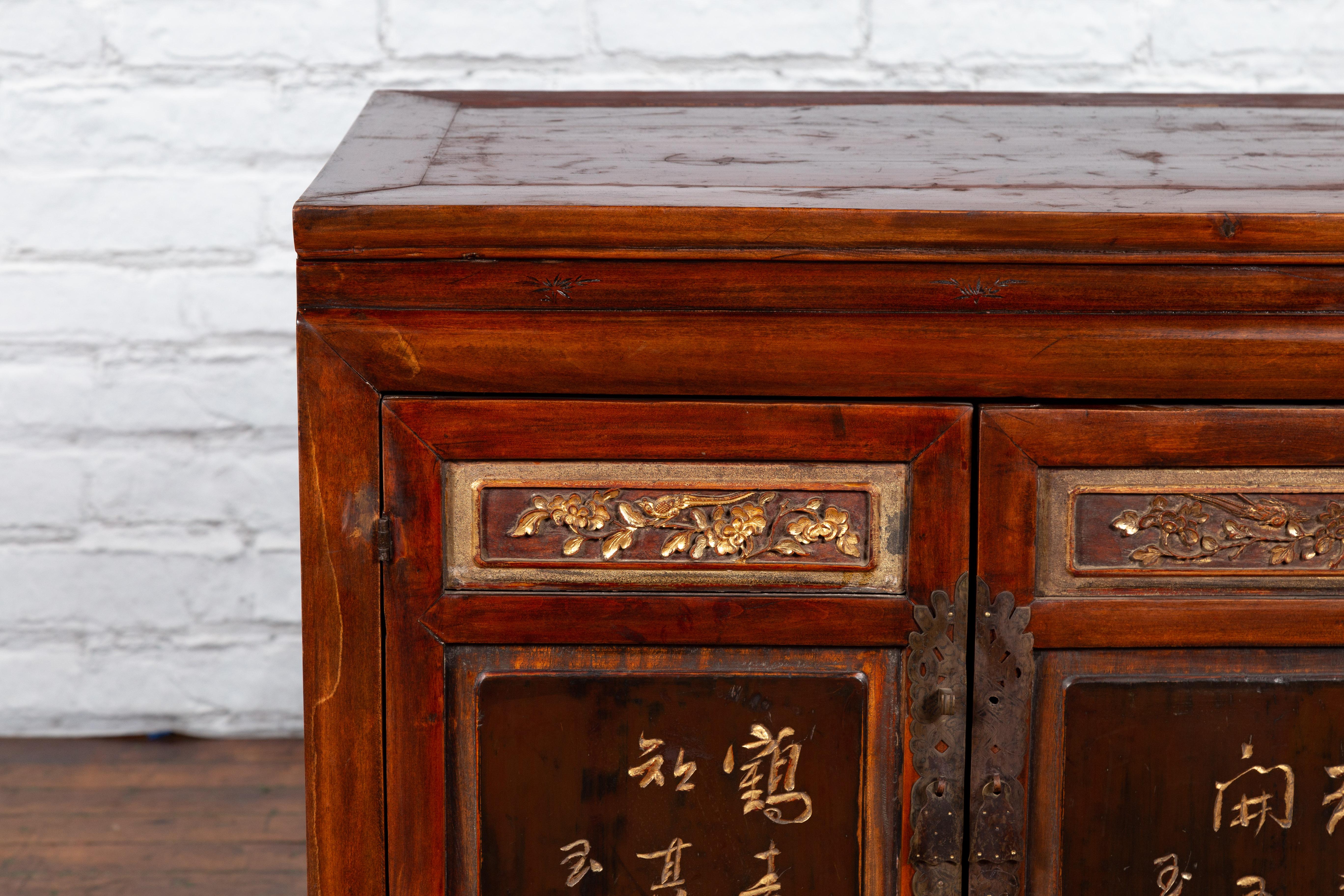 Chinese Early 20th Century Cabinet with Carved Gilded Flowers and Calligraphy 2