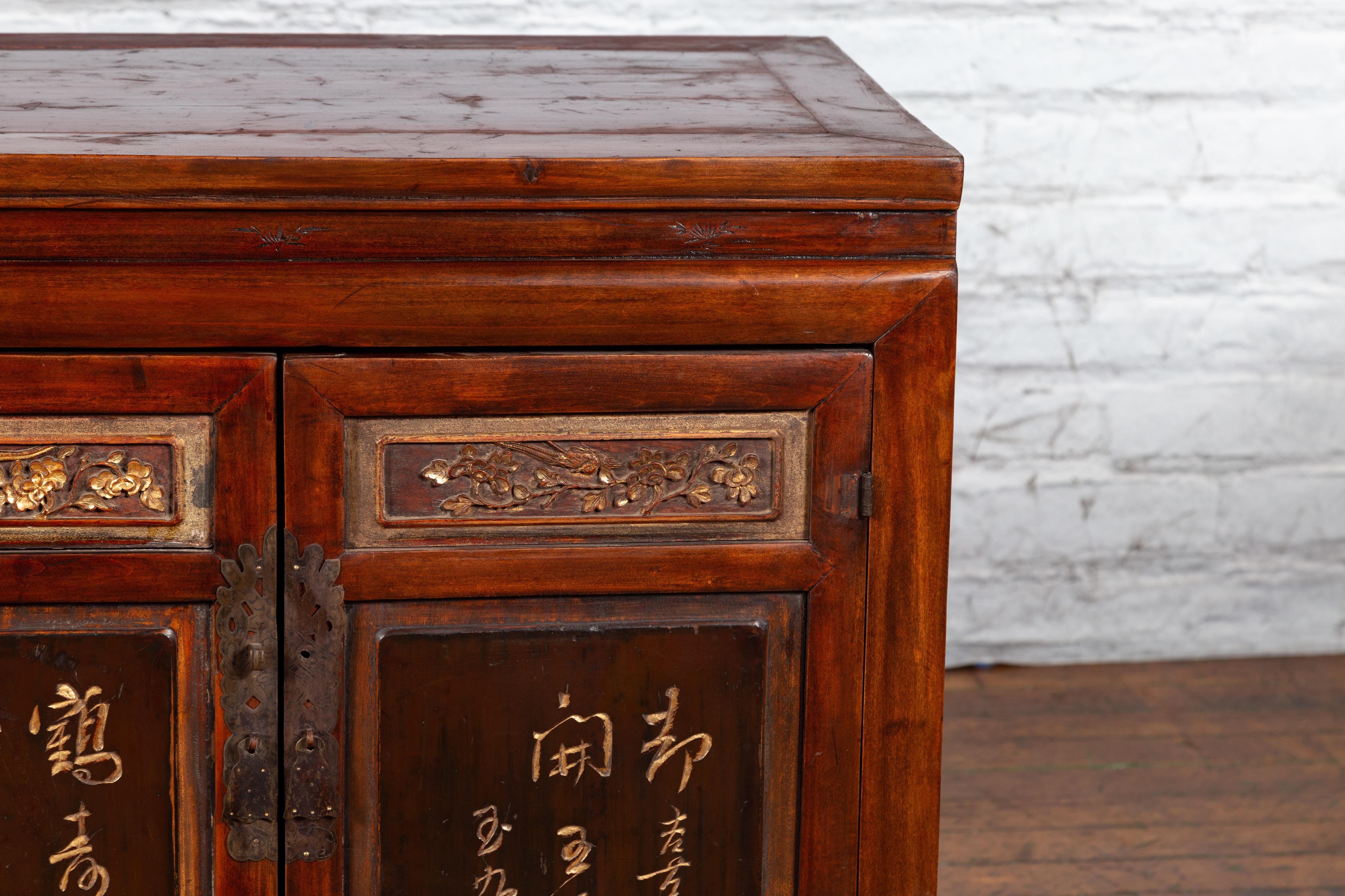 Chinese Early 20th Century Cabinet with Carved Gilded Flowers and Calligraphy 3
