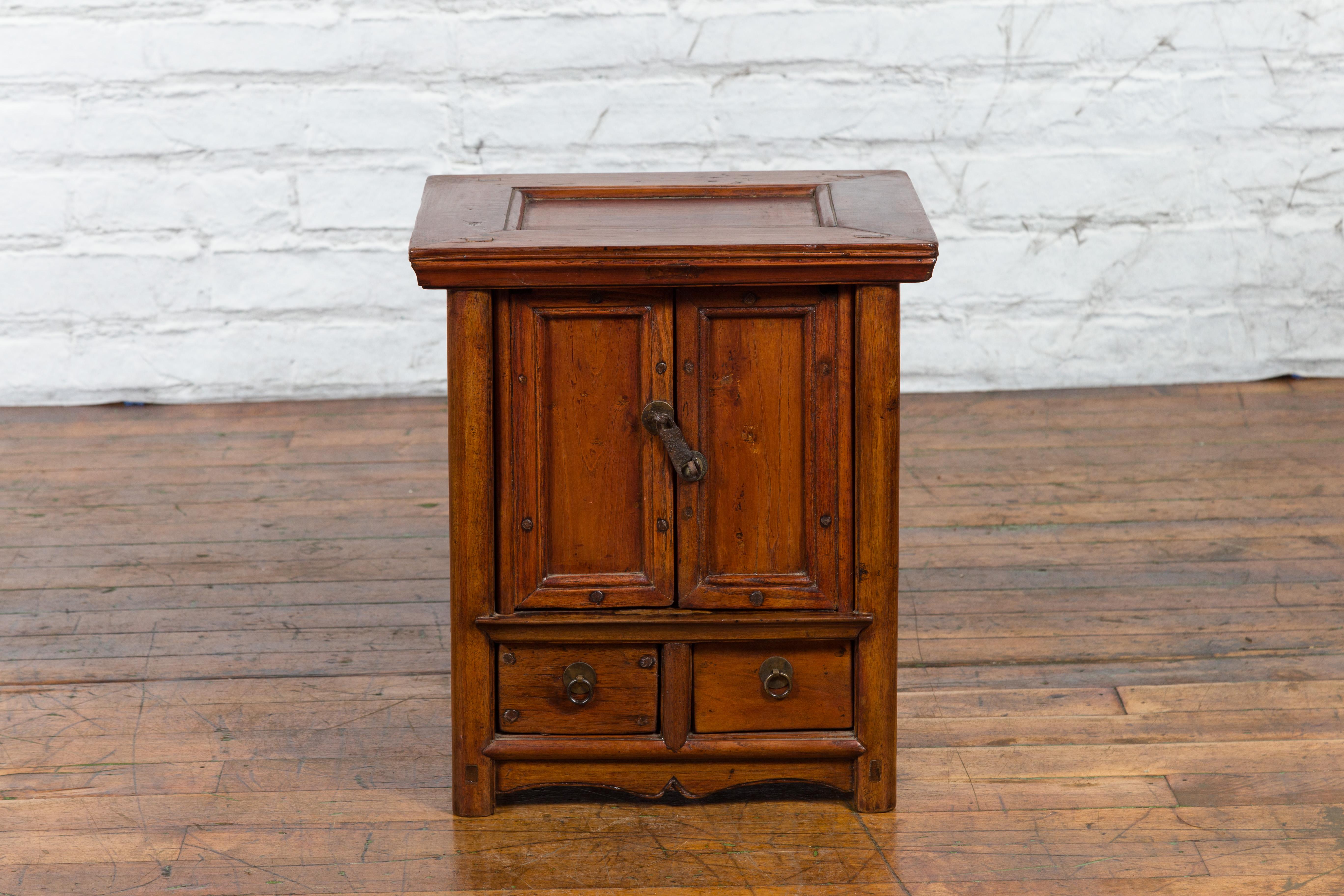 Carved Chinese Early 20th Century Elmwood Bedside Cabinet with Scalloped Apron For Sale