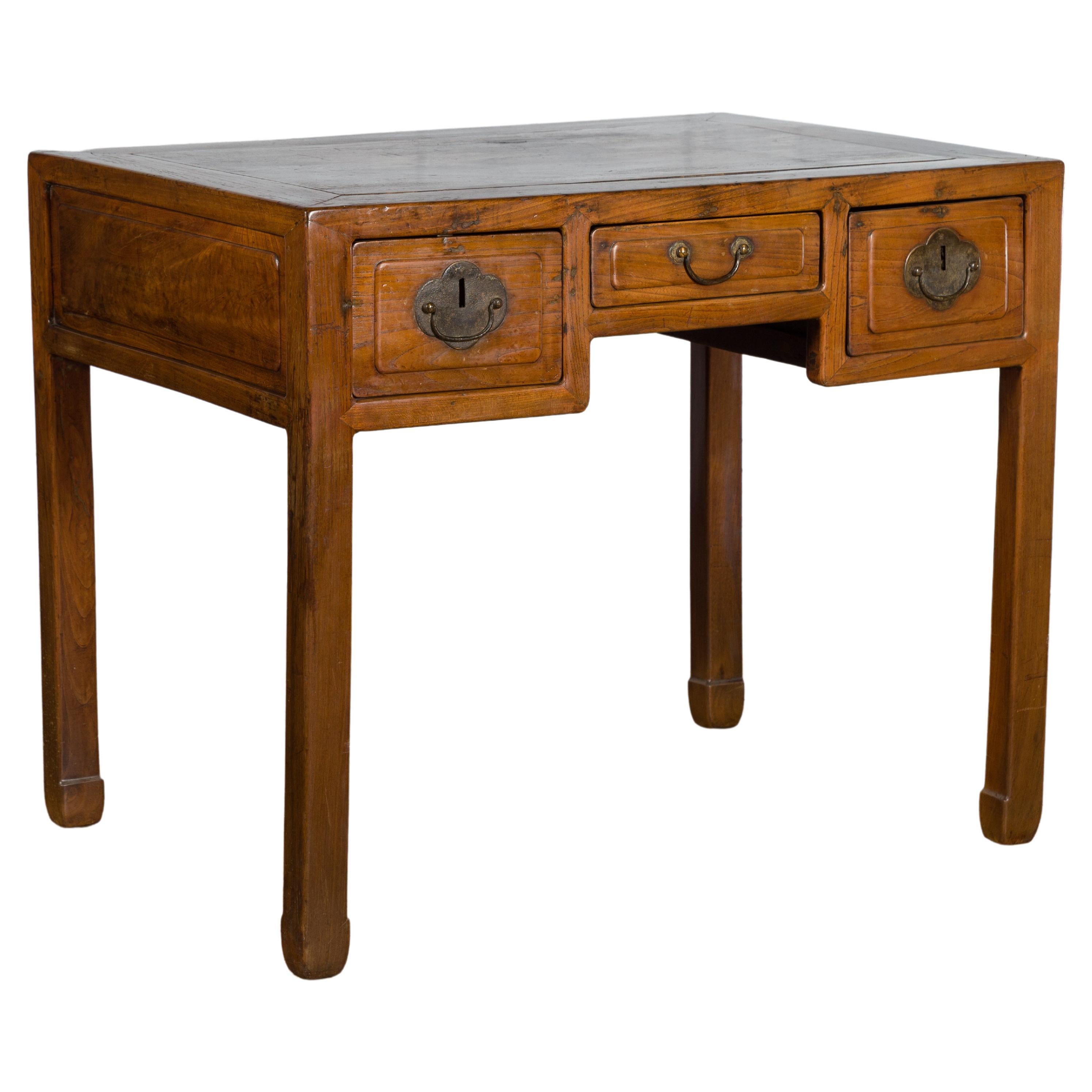 An antique Chinese three-drawer desk from the Fujian Province, with straight legs and horse hoof extremities. Created in the South-Eastern Province of Fujian during the early years of the 20th century, this desk / console table features a