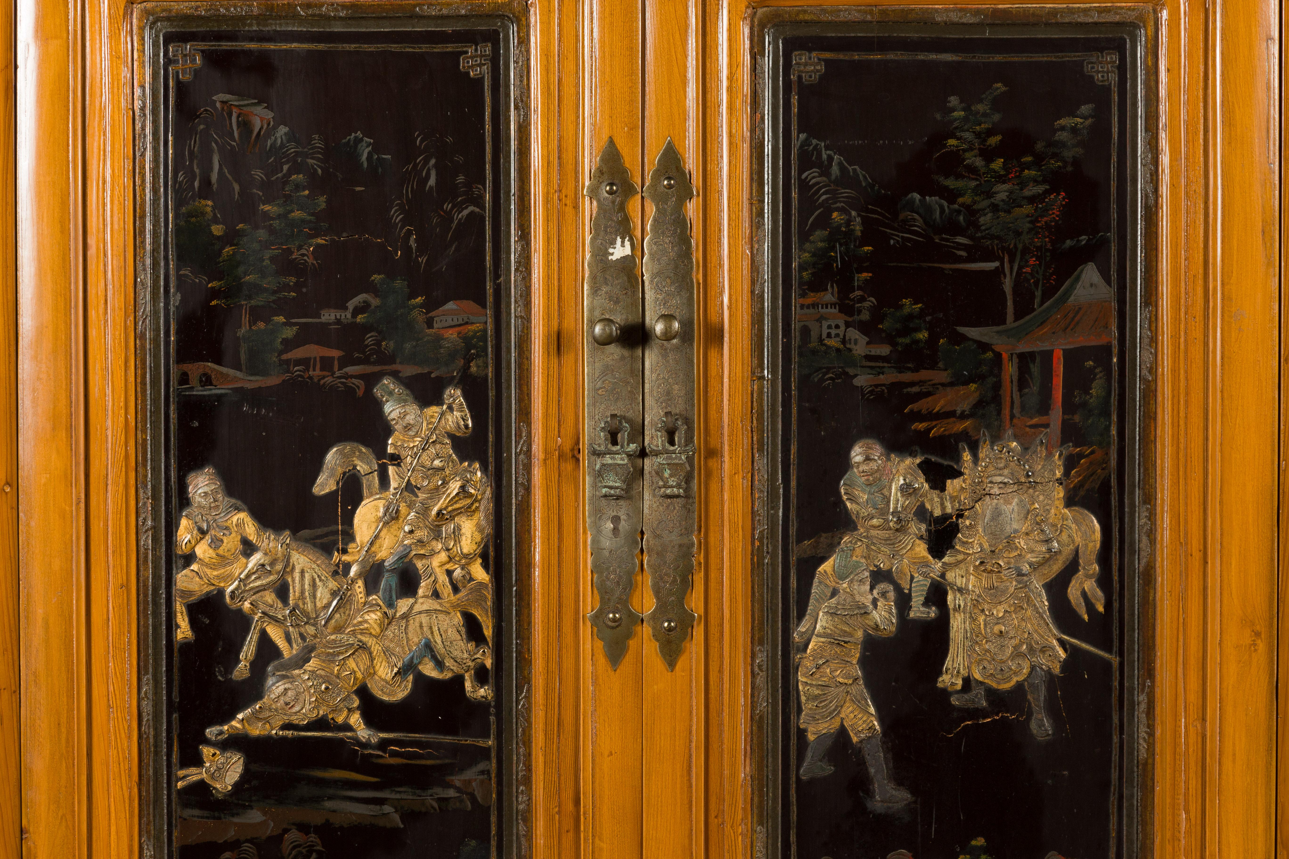 Chinese Early 20th Century Lacquered Armoire with Gilt Carved Warrior Motifs For Sale 8