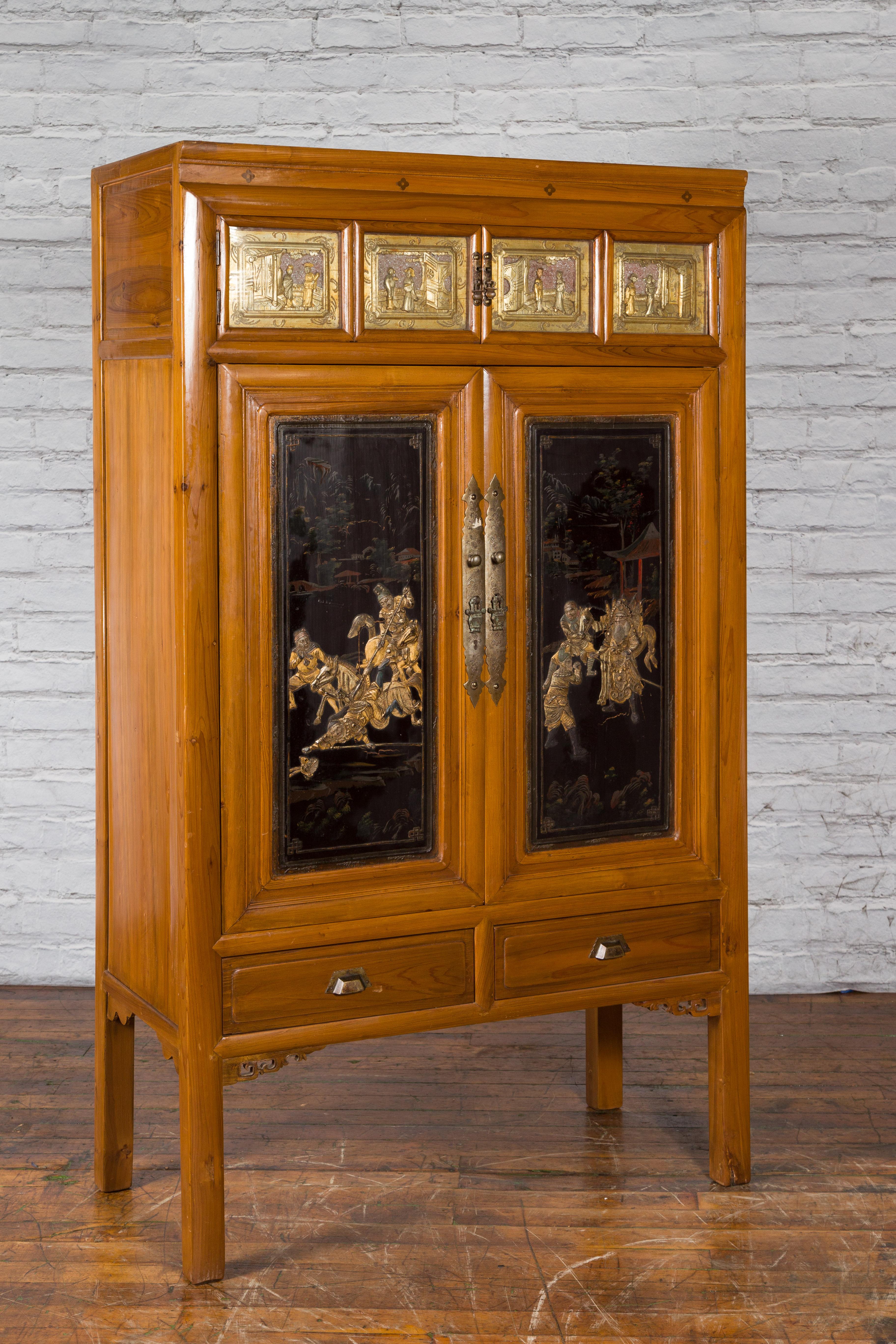 Hand-Carved Chinese Early 20th Century Lacquered Armoire with Gilt Carved Warrior Motifs For Sale