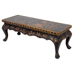 Table basse chinoise en bois ébonisé et doré