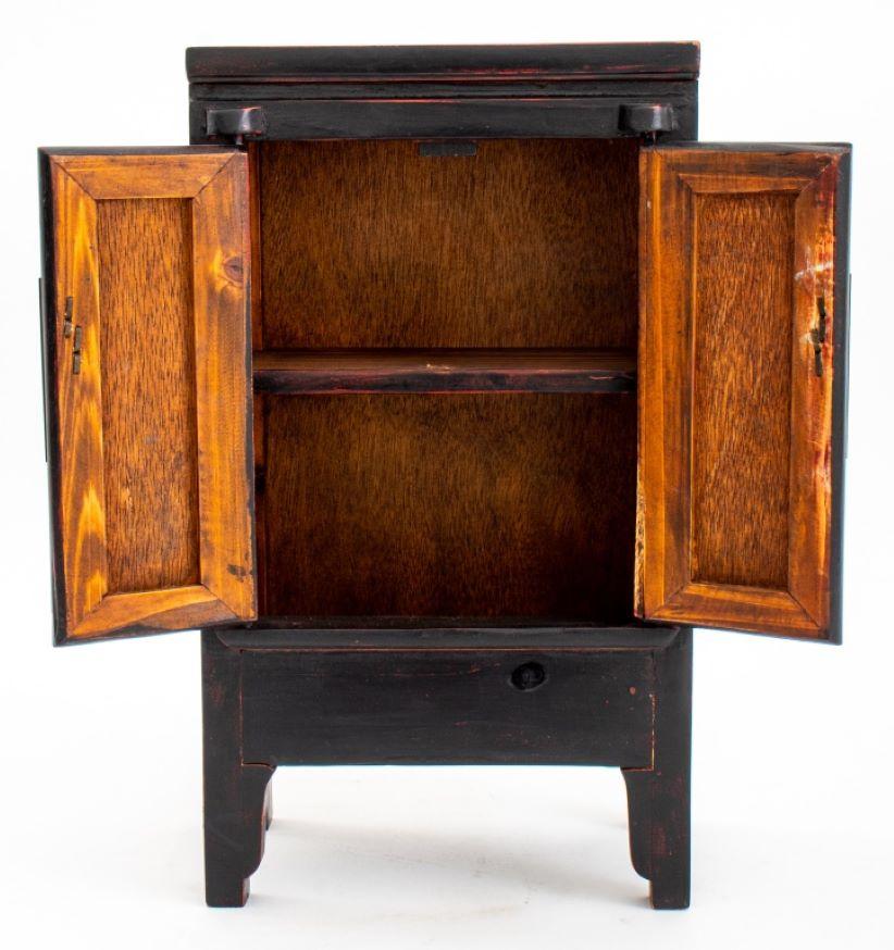Chinese Chippendale Chinese Ebonized Wood Diminutive Chest For Sale