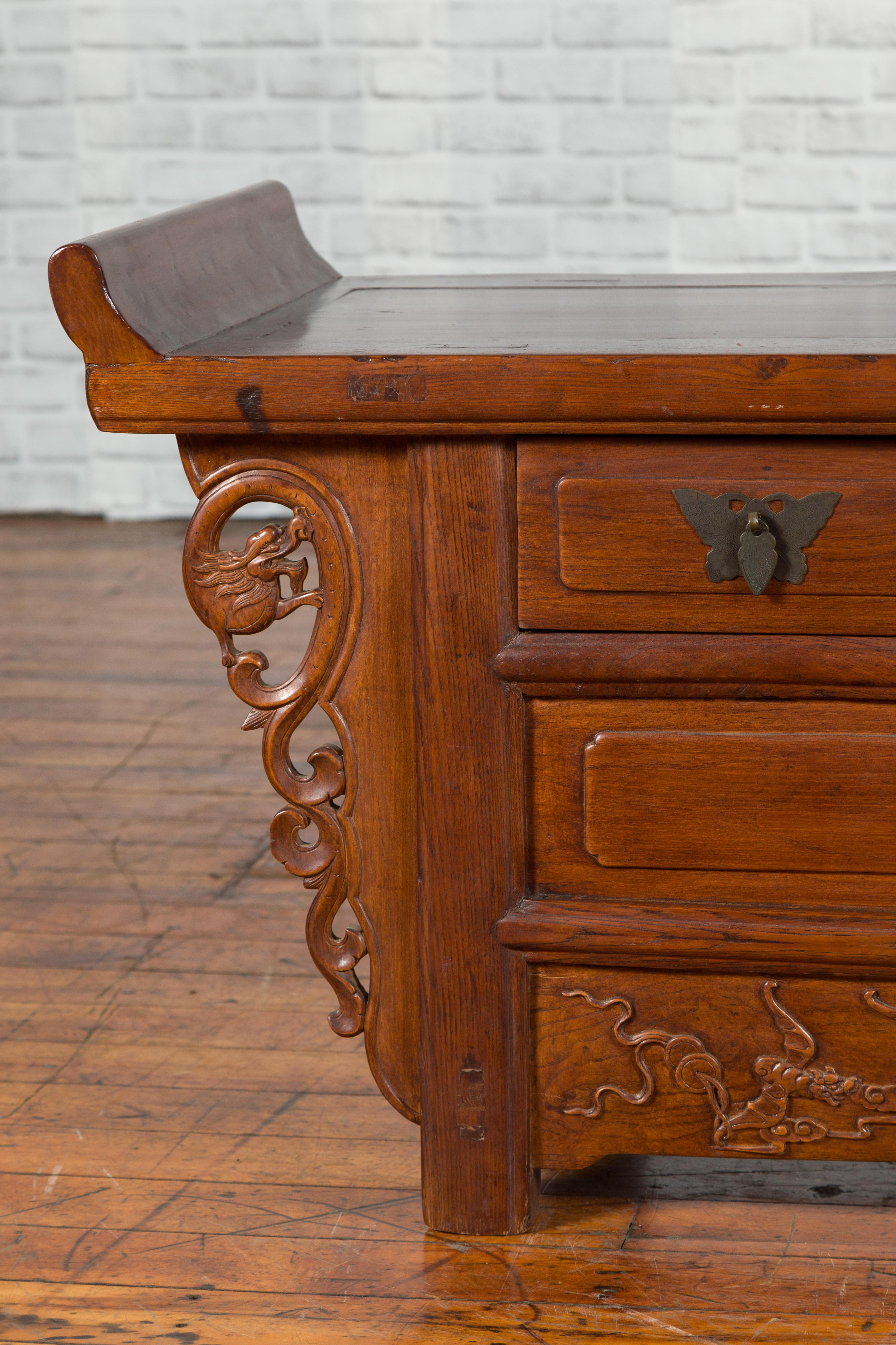 Chinese Elm Three-Drawer Kang Cabinet with Everted Flanges and Carved Spandrels In Good Condition For Sale In Yonkers, NY