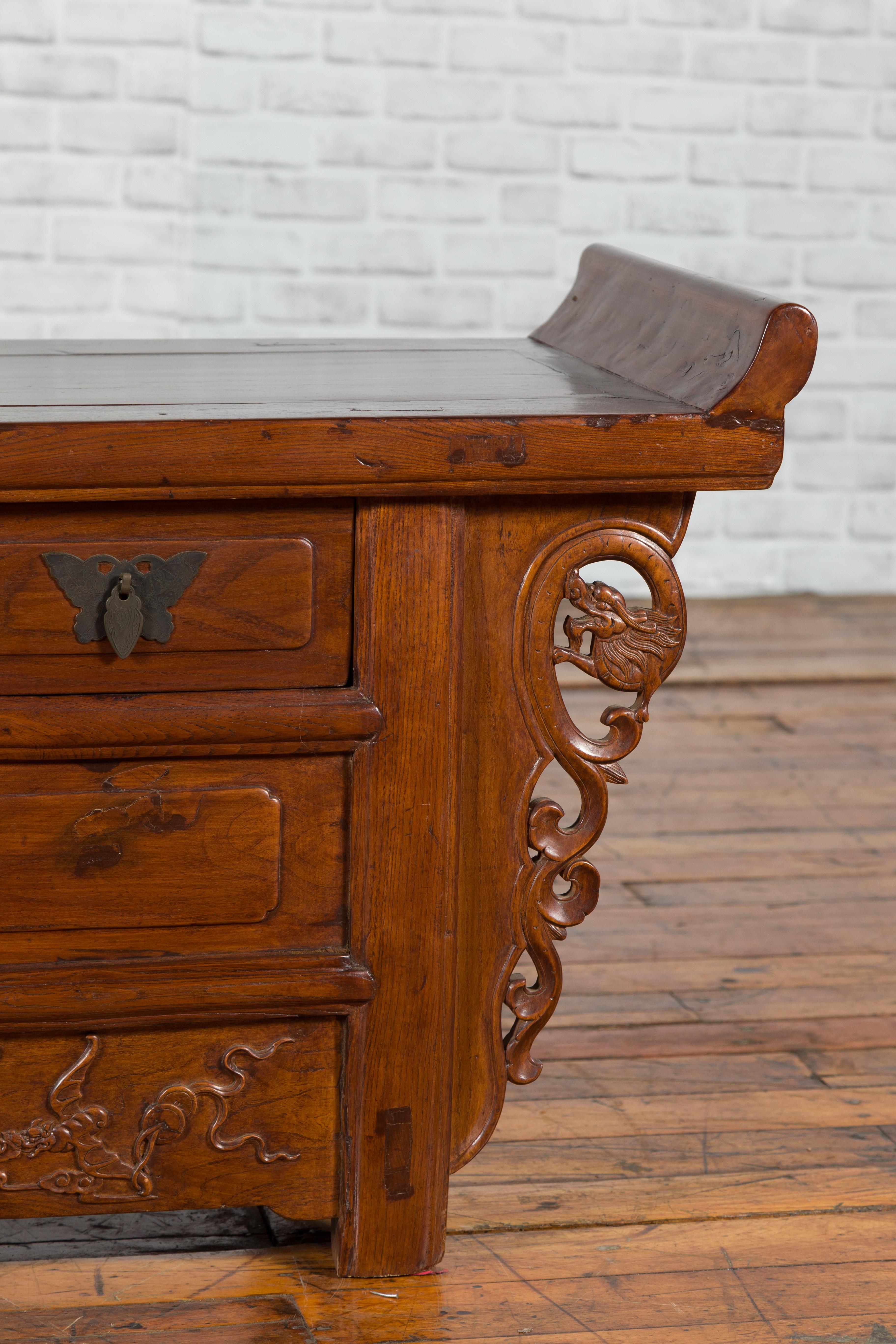 19th Century Chinese Elm Three-Drawer Kang Cabinet with Everted Flanges and Carved Spandrels For Sale